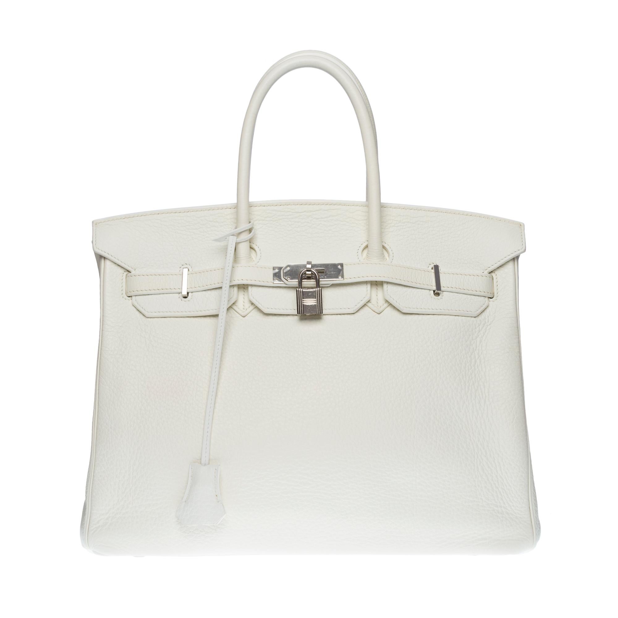 Gorgeous Hermes Birkin 35 handbag in white Taurillon Clémence leather, palladium silver metal hardware, double handle in beige leather allowing a hand-carried
Flap closure
White leather lining, one zippered pocket, one patch pocket
Signature: