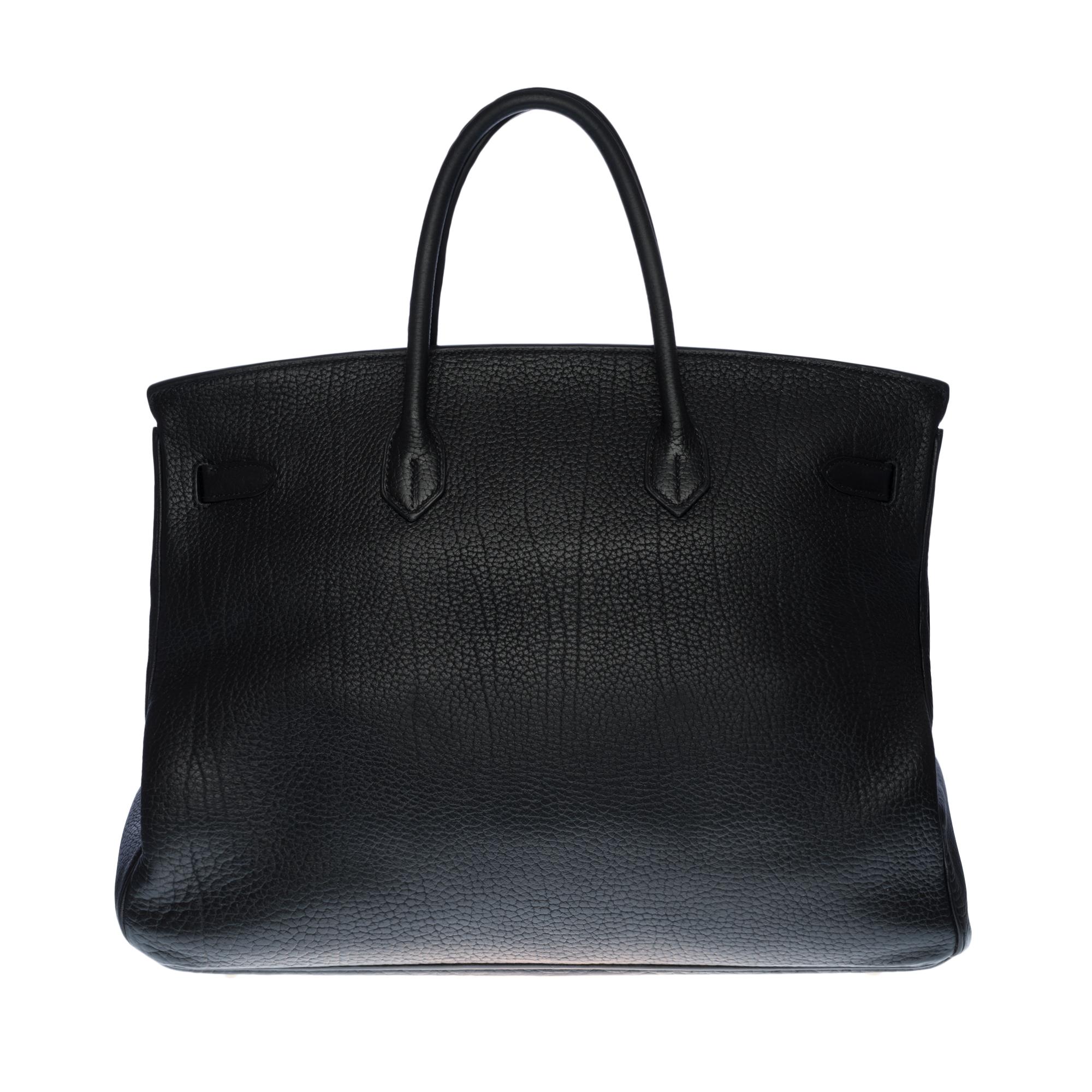 Stunning Hermes Birkin Handbag 40 cm in black Togo leather, gold plated metal hardware, double black leather handle allowing a hand carry
Flap closure
Black leather lining, one zippered pocket, one patch pocket
Signature: 