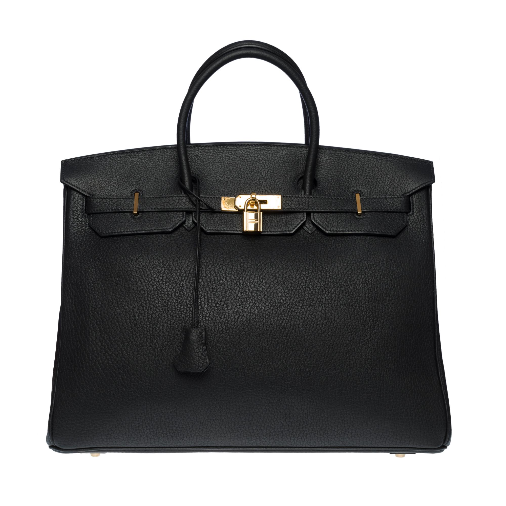 Amazing Hermes Birkin 40 handbag in black togo leather, gold plated metal hardware, double black leather handle for a hand-held
Flap closure
Black leather lining, one zippered pocket, one patch pocket
Signature: 