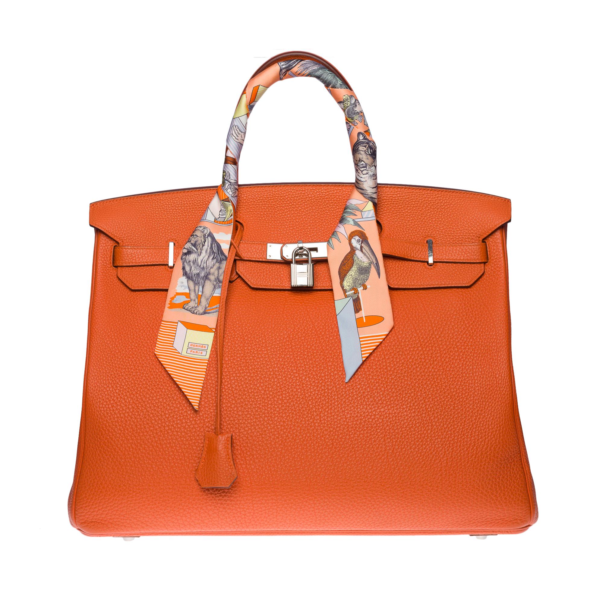 Beautiful Hermes Birkin 40 handbag in Orange Terre battue Togo leather , palladium silver metal hardware, double handle in orange leather allowing a hand-carried

Flap closure
Orange leather lining, one zippered pocket, one patch pocket
Signature: