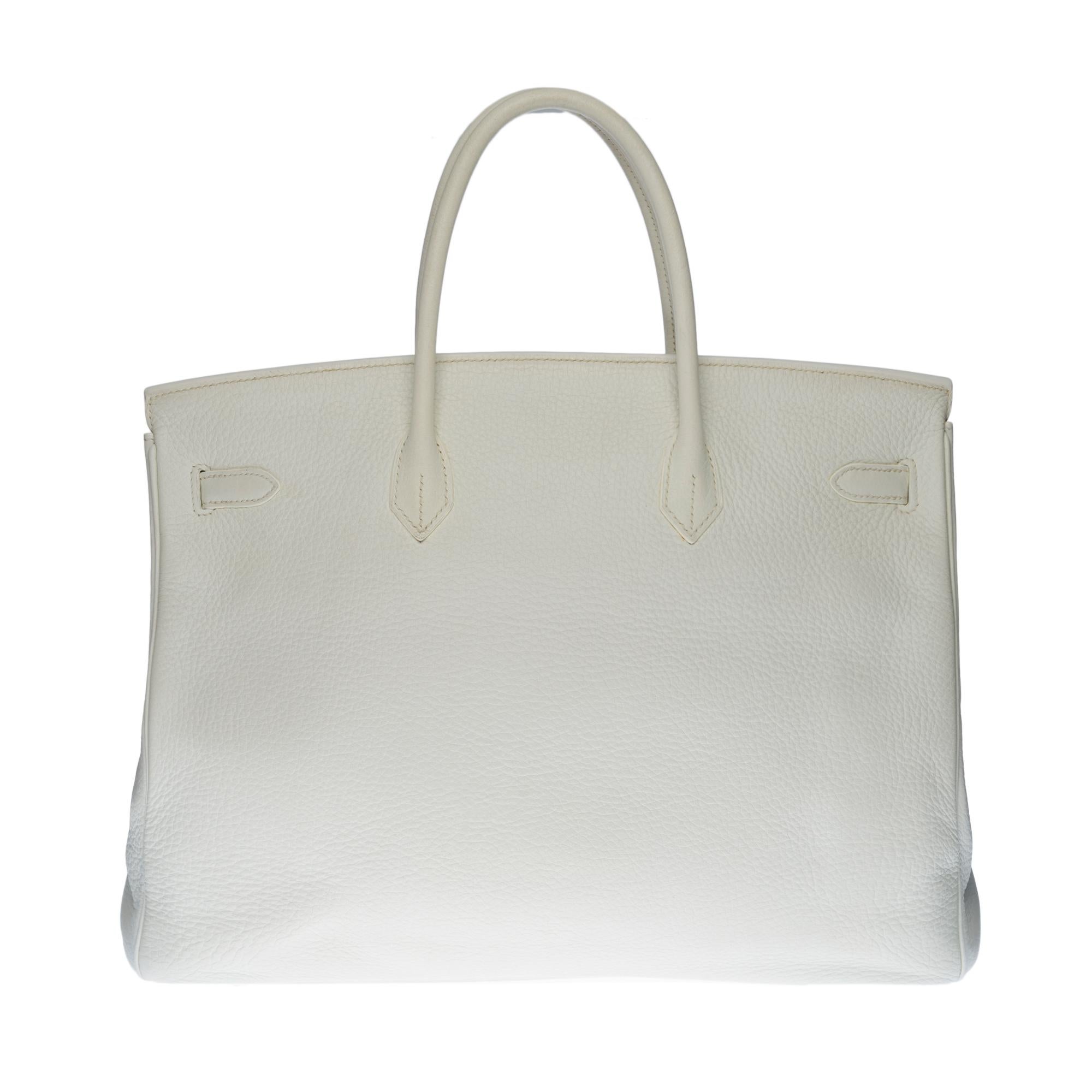 Beautiful Hermes Birkin 40 cm handbag in white Togo leather, palladium silver metal hardware, double handle leather bench allowing a handheld

Flap closure
Lining in white leather, one zip pocket, one patch pocket
Signature: 