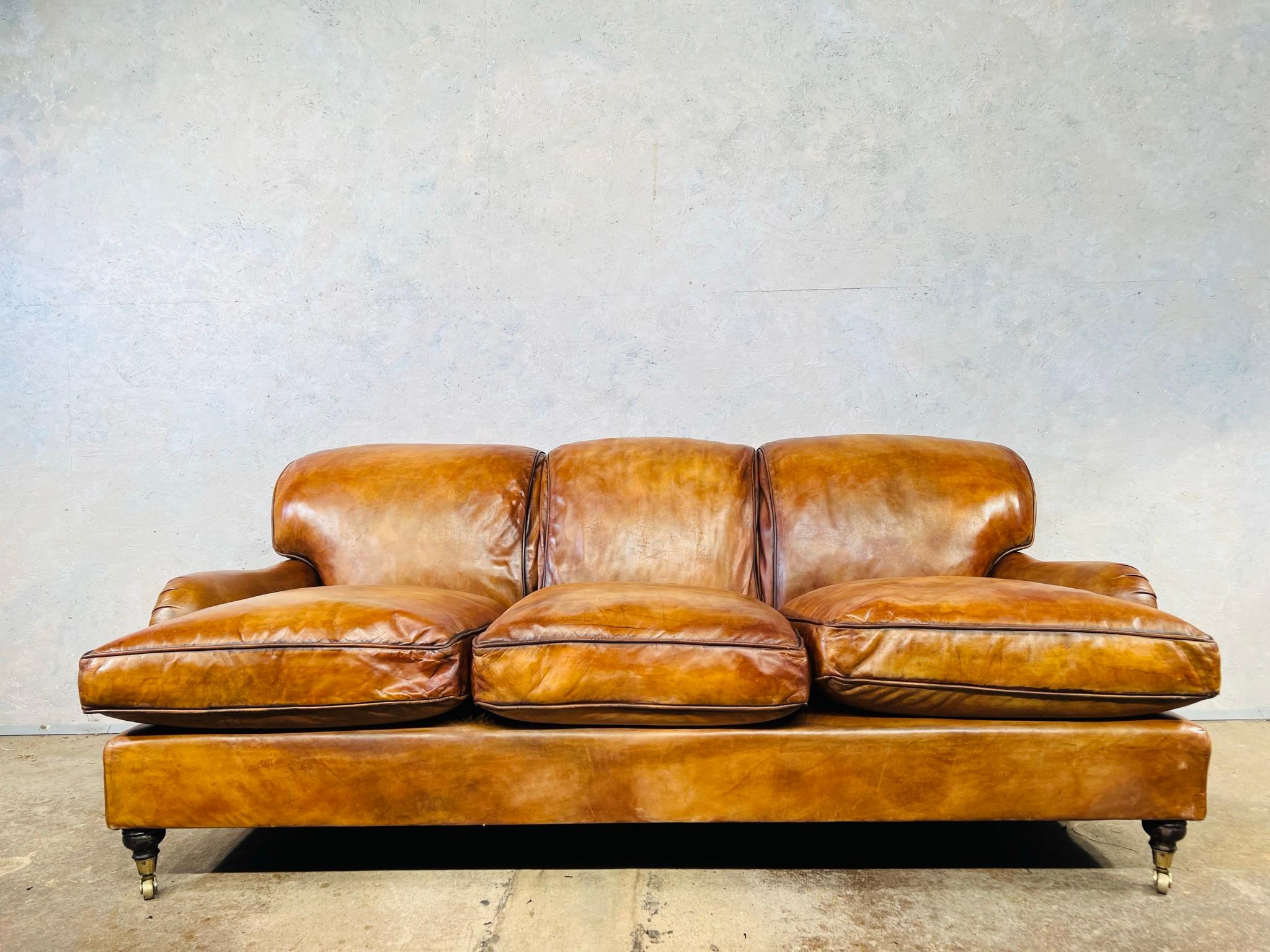 A stunning English made Mid Century Howard & Sons Three seater Leather sofa. A timeless classic, a great design it stands beautifully and is incredibly comfortable being deep seated with feather filled cushions.

An exceptional Hand dyed light tan