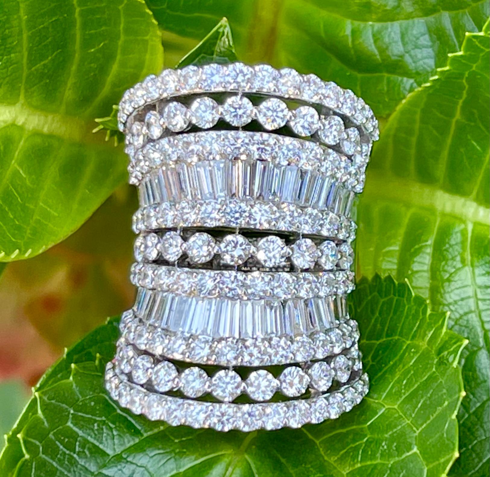 Absolutely stunning, glorious 7 layer curving diamond band ring features seven rows of round brilliant and baguette cut diamonds.  The baguette diamonds are invisibly set in between rows of round brilliant diamonds on each side.  The repetitive