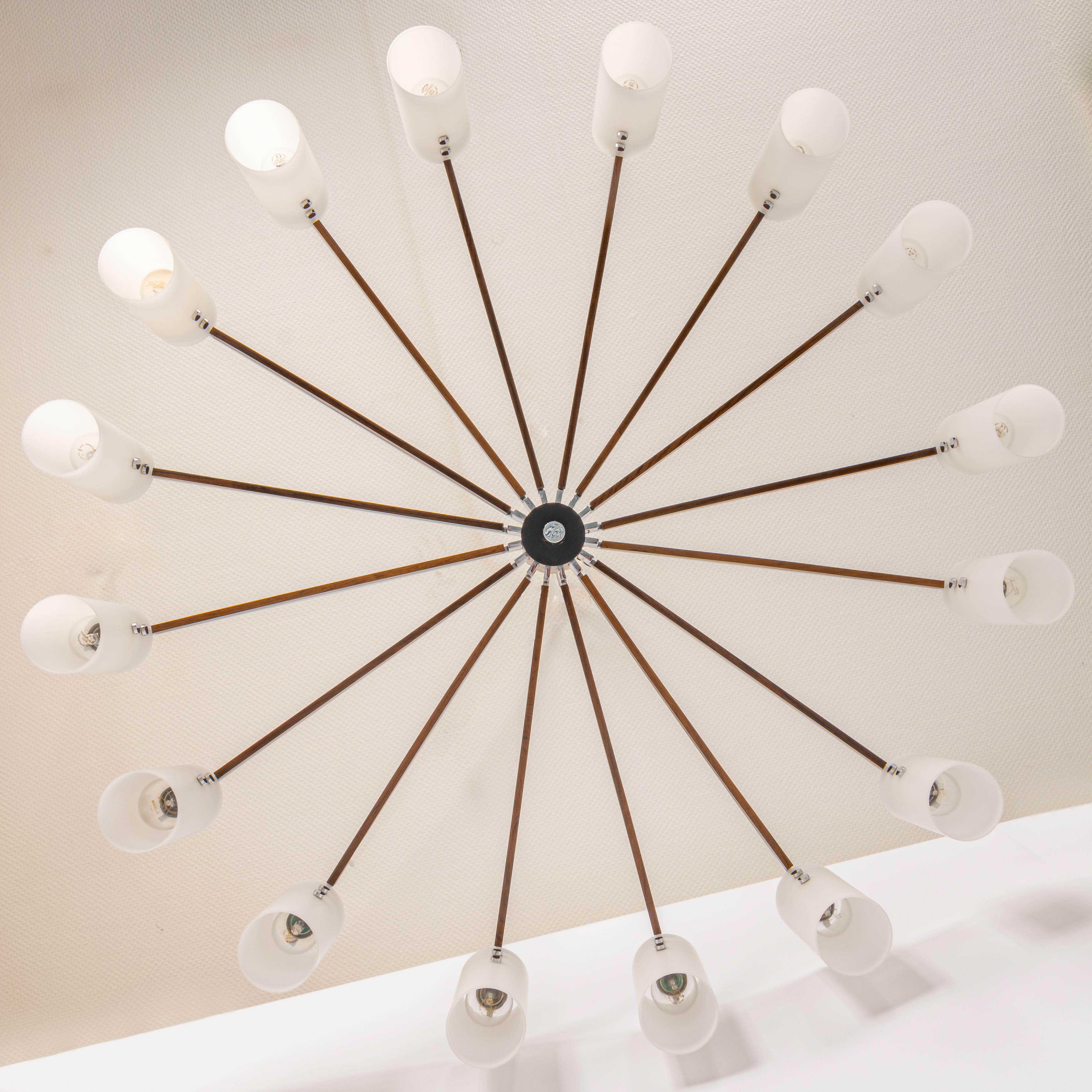 A stunning extra large sixteen-arm spider flush mount light chandelier by Kaiser Leuchten, Germany, manufactured in midcentury, circa 1970 (late 1960s or early 1970s). The fixture is in very good condition and ready to use.
Small Signs of age and