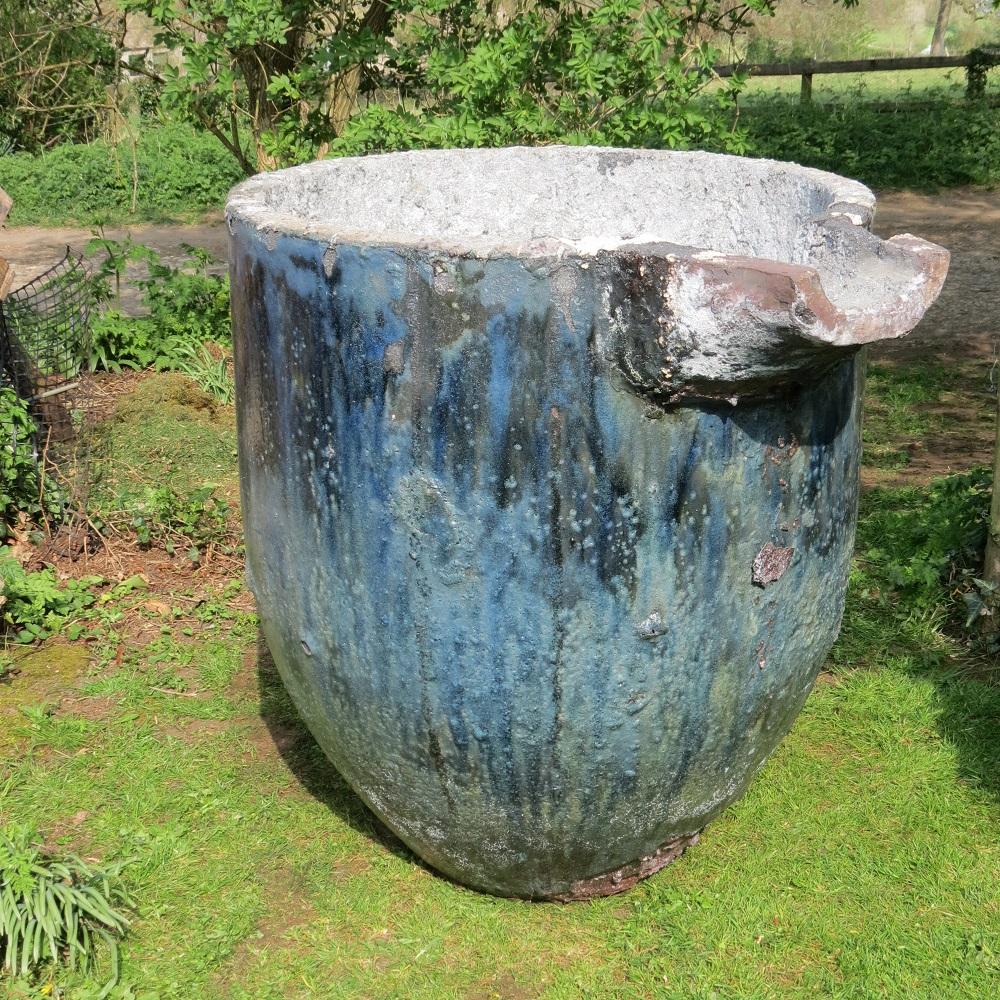 Stunning, extremely large foundry Crucible with incredible glaze and patination to the outside formed by the pouring and splashing of the molten metal adhering to the sides of the Crucible.

This one was probably used for aluminum, which has