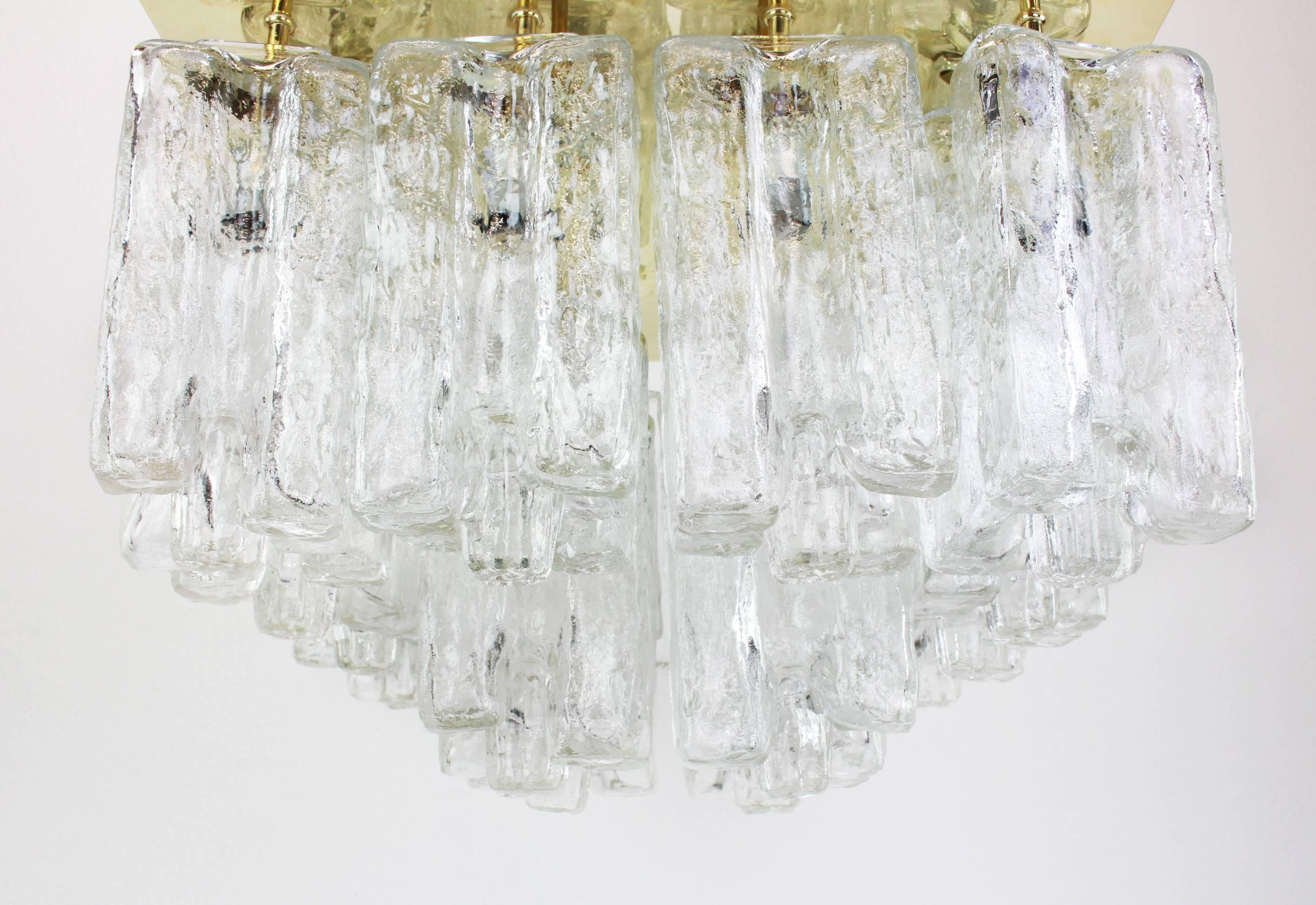 A stunning huge flush mount by Kalmar, Austria, manufactured in 1970s.
The flush mount is composed of 16 thick textured ice glass elements (Granadas) attached to a gold-brass frame.
Dimensions
H 14.18 in. x W 19.69 in. x D 19.69 in.
H 36 cm x W 50
