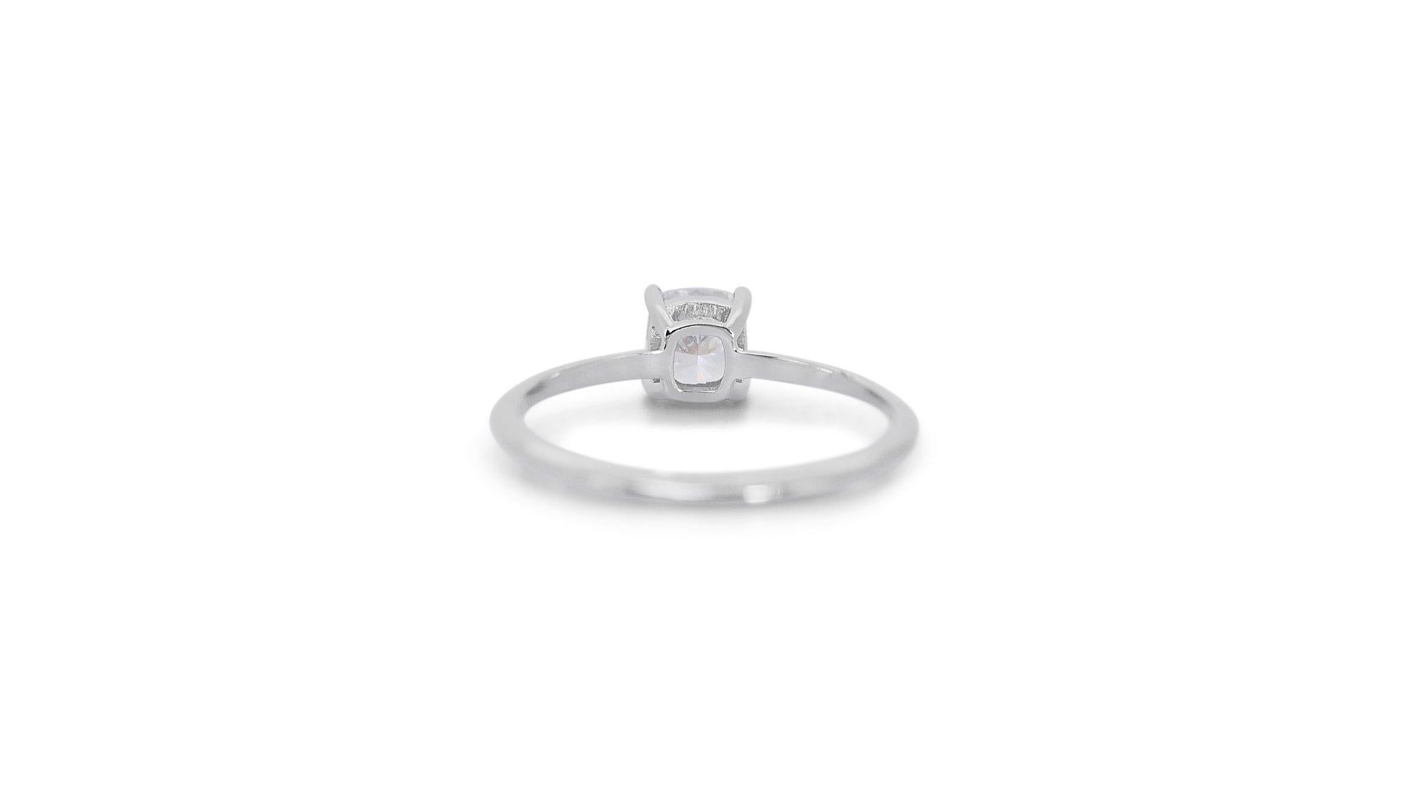 Stunning Ideal Cut Solitaire Ring w/1.00ct - GIA Certified 

This exquisite piece showcases a captivating 1.00 carat diamond, meticulously cut in a modified brilliant style to maximize its brilliance. This stunning diamond is verified by the
