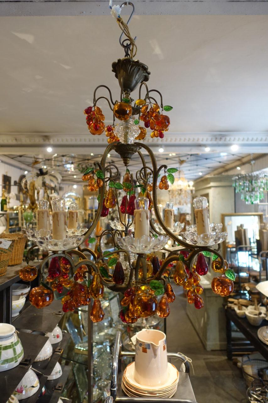 Spectacular, colourful and imaginative vintage (1940-1950s) French chandelier with a cast bronze frame and beautifully decorated with numerous handmade stained glass fruits and bunches of grapes. This ceiling lamp has 8 electricity sources, with