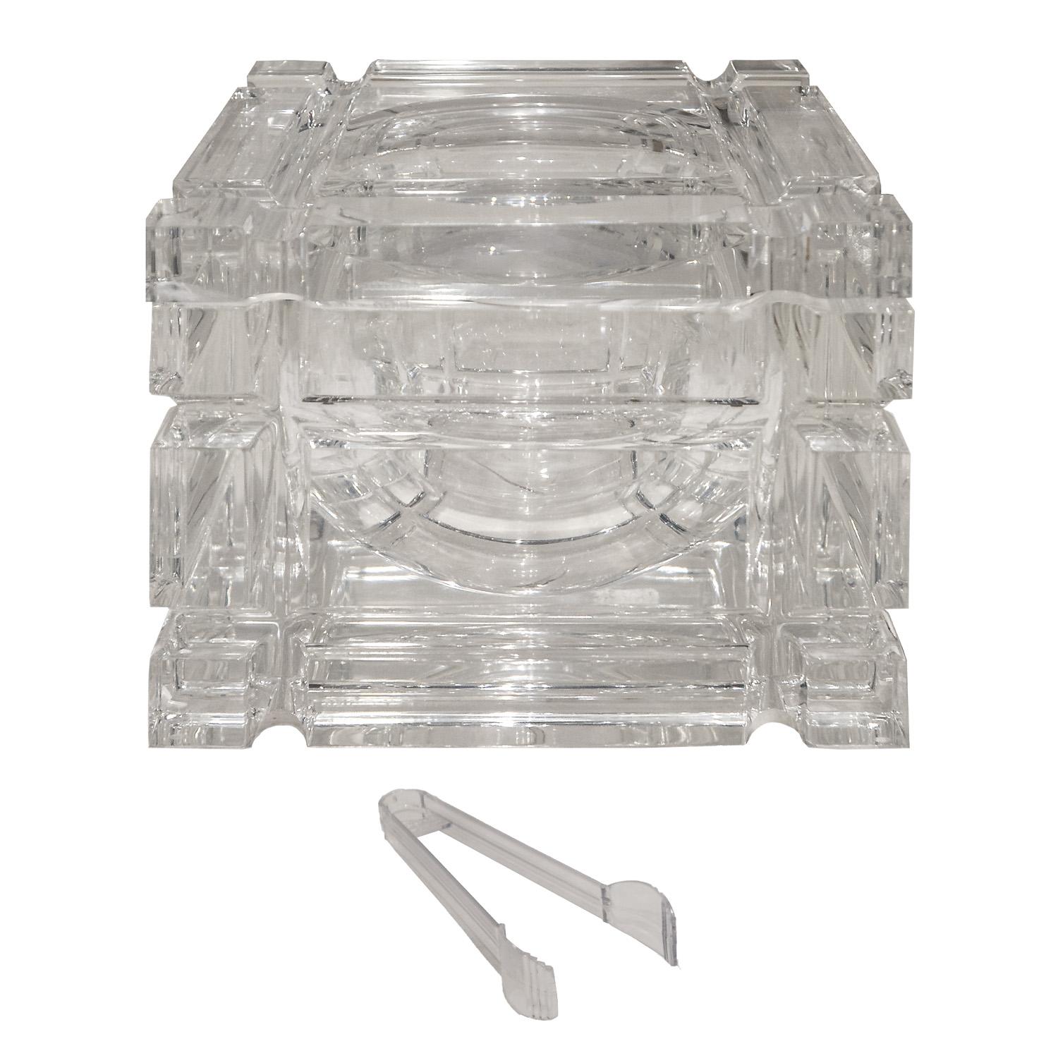 Beautifully crafted and stunning ice bucket in solid molded and polished lucite on a swivel hinge with original ice tongs, Italian 1970s.  This is one of the best lucite ice buckets we have seen.  Super high quality.