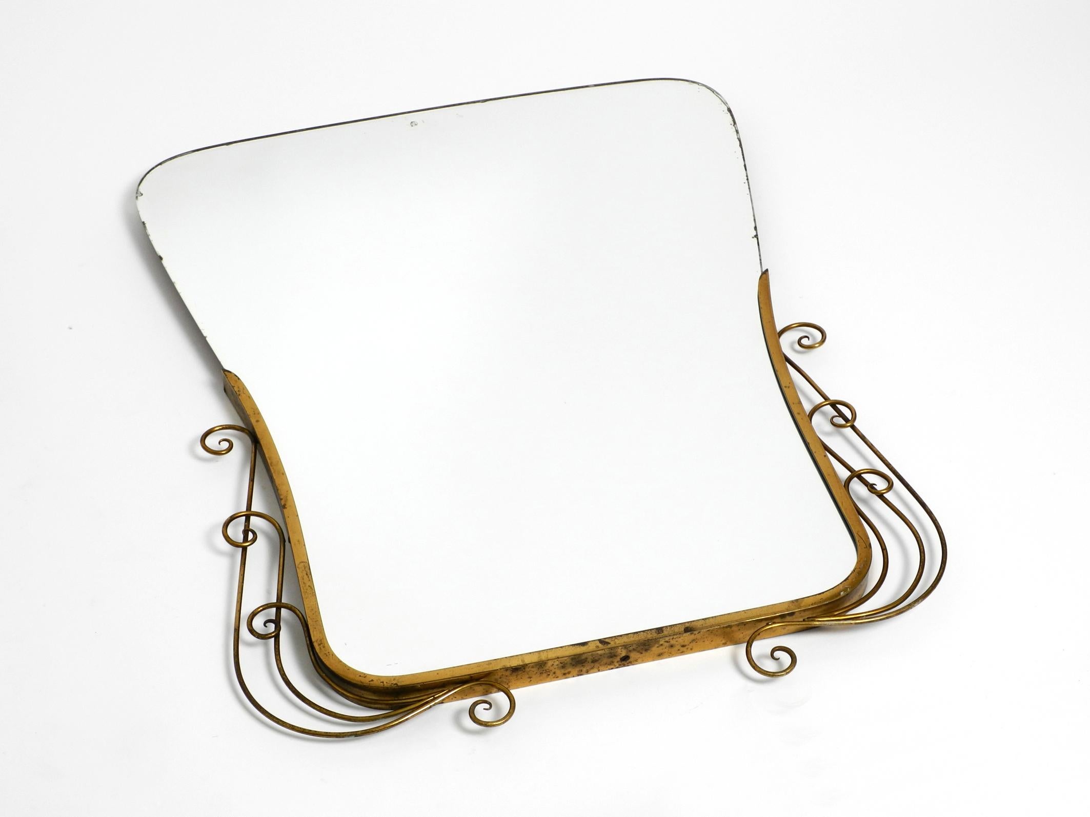 Mid-Century Modern Stunning Italian Mid Century Wall Mirror with an Ornate Brass Frame