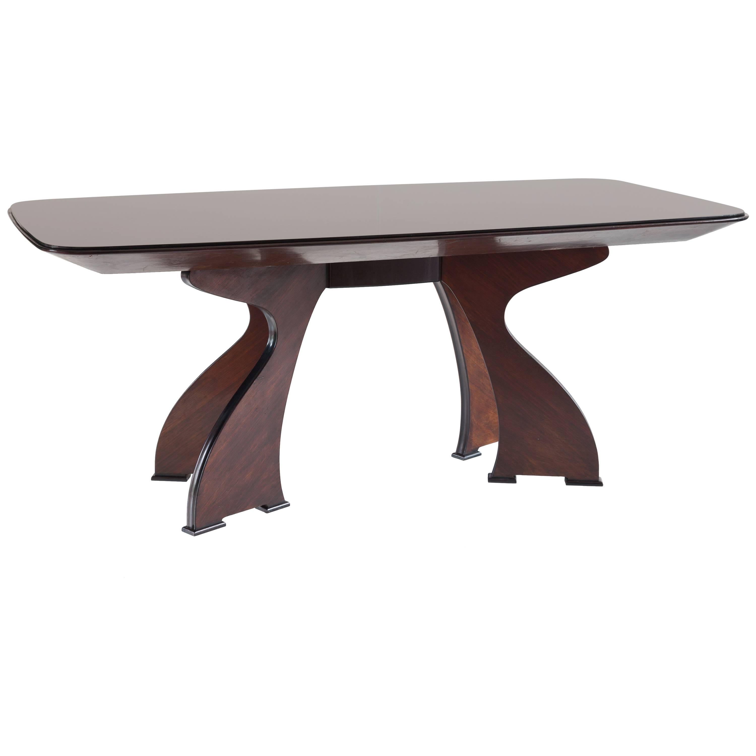 Stunning Italian modern dining table, circa 1940.
Unique piece in the style of Guglielmo Ulrich.
Very good original condition
Rosewood, rare black opaline glass top
ebonized details.
Measures: H 82 cm 200 x 96 cm.
 