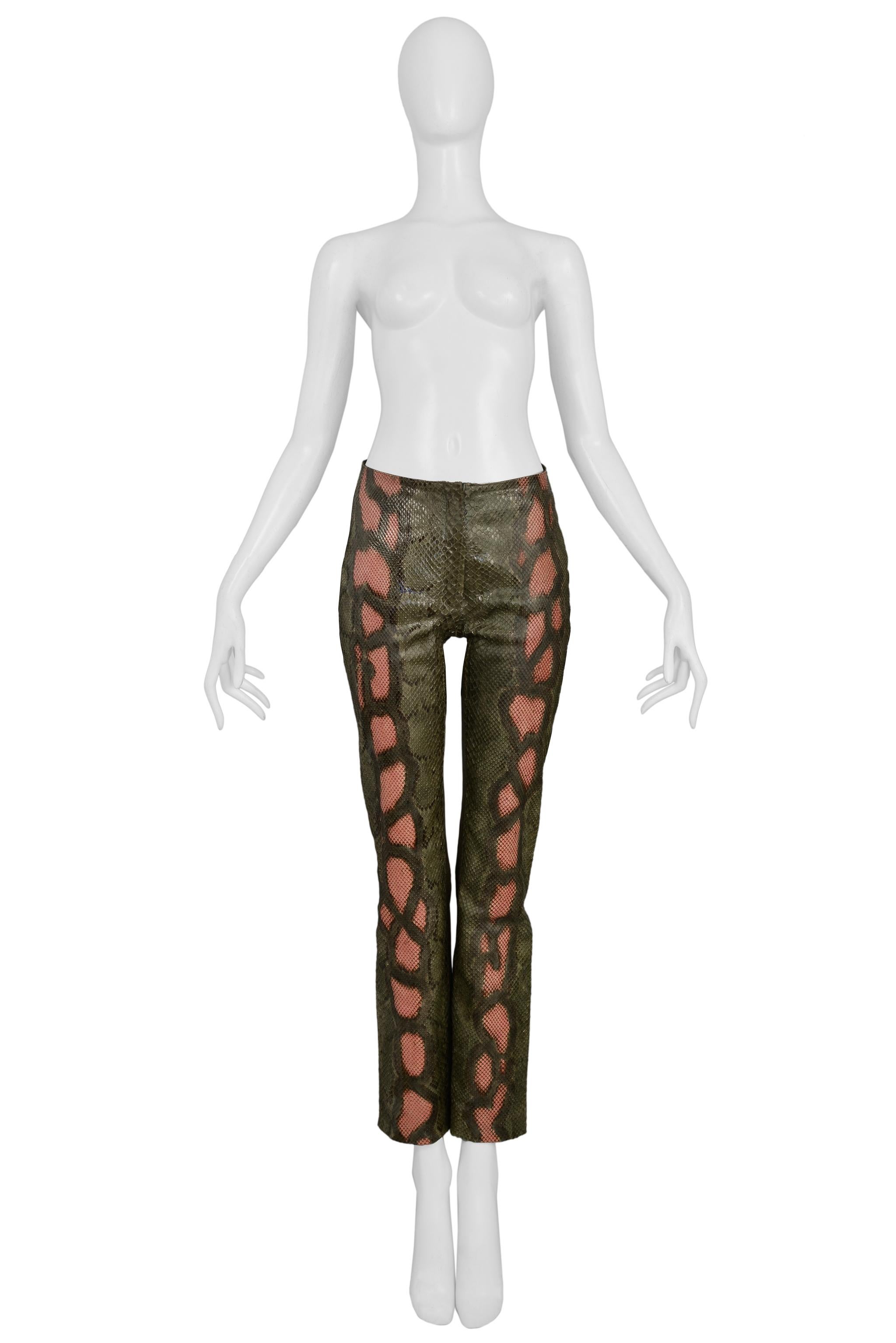Resurrection Vintage is excited to offer a pair of vintage Jean-Claude Jitrois green and pink python leather pants featuring a center front zipper, front panel lining, slim fit, and a leather back panel. Appear unworn. 

Jitrois, Paris
Size: