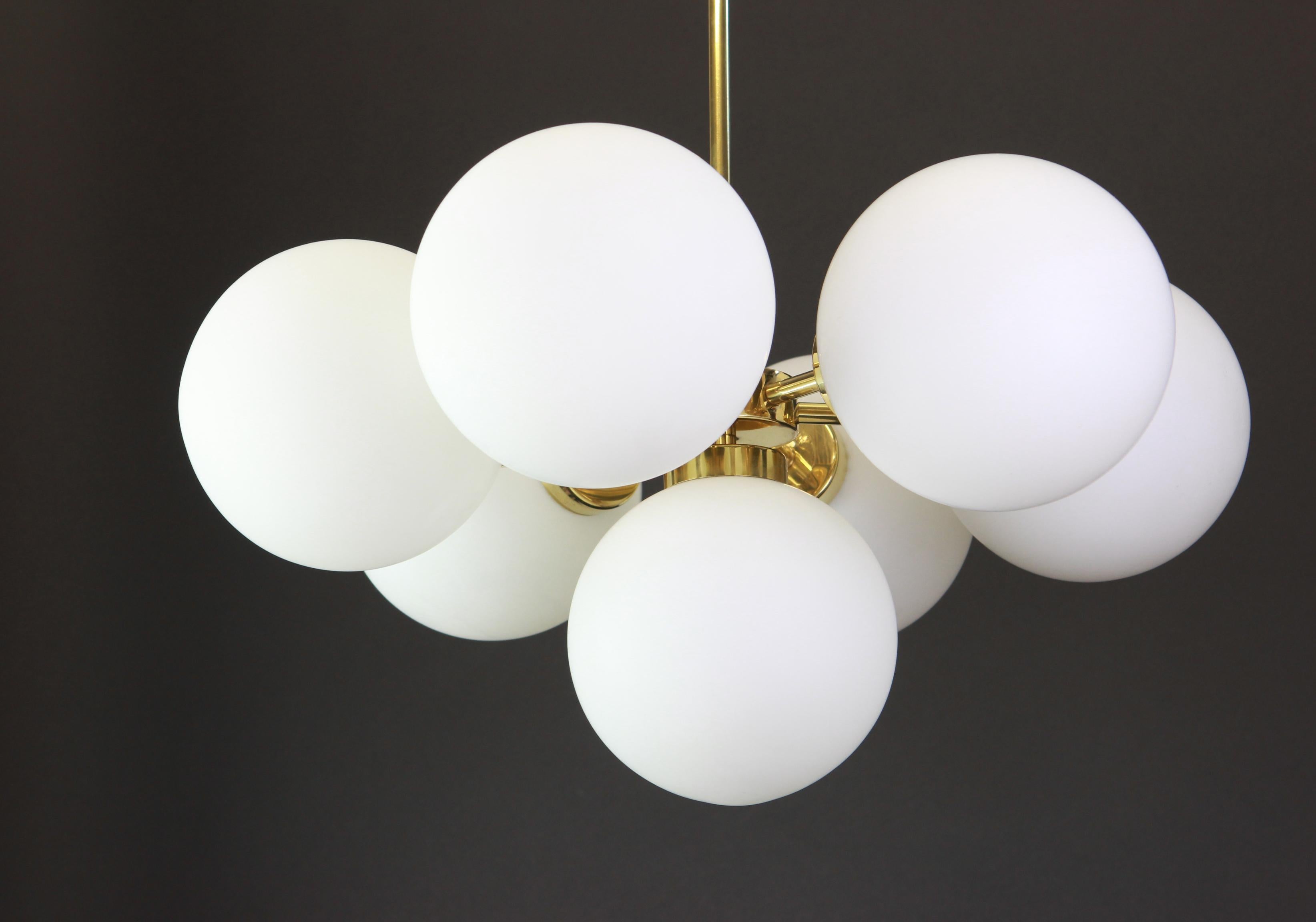 Stunning radial Sputnik chandelier with seven opal glass globes by Kaiser Leuchten, Germany, 1960s.
High quality and in very good condition. Cleaned, well-wired and ready to use. 

The fixture requires 6 x E14 Standard bulbs and is compatible with