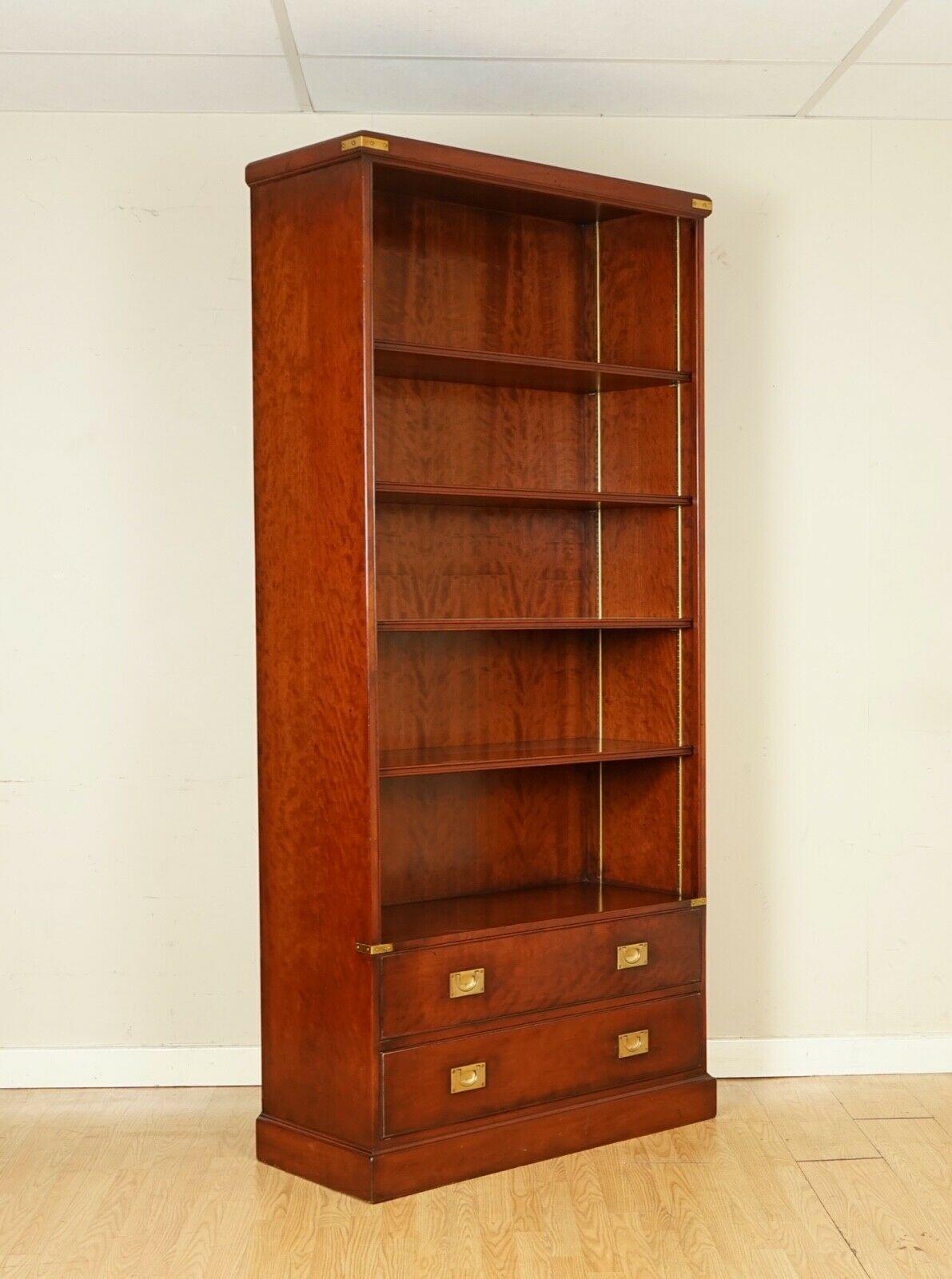 We are delighted to offer this Stunning Kennedy Furniture Military Campaign Bookcase Handmade in England.
This bookcase was retailed through Harrods London, this is one of the finest high bookcases. 
Very well made featuring two drawers and