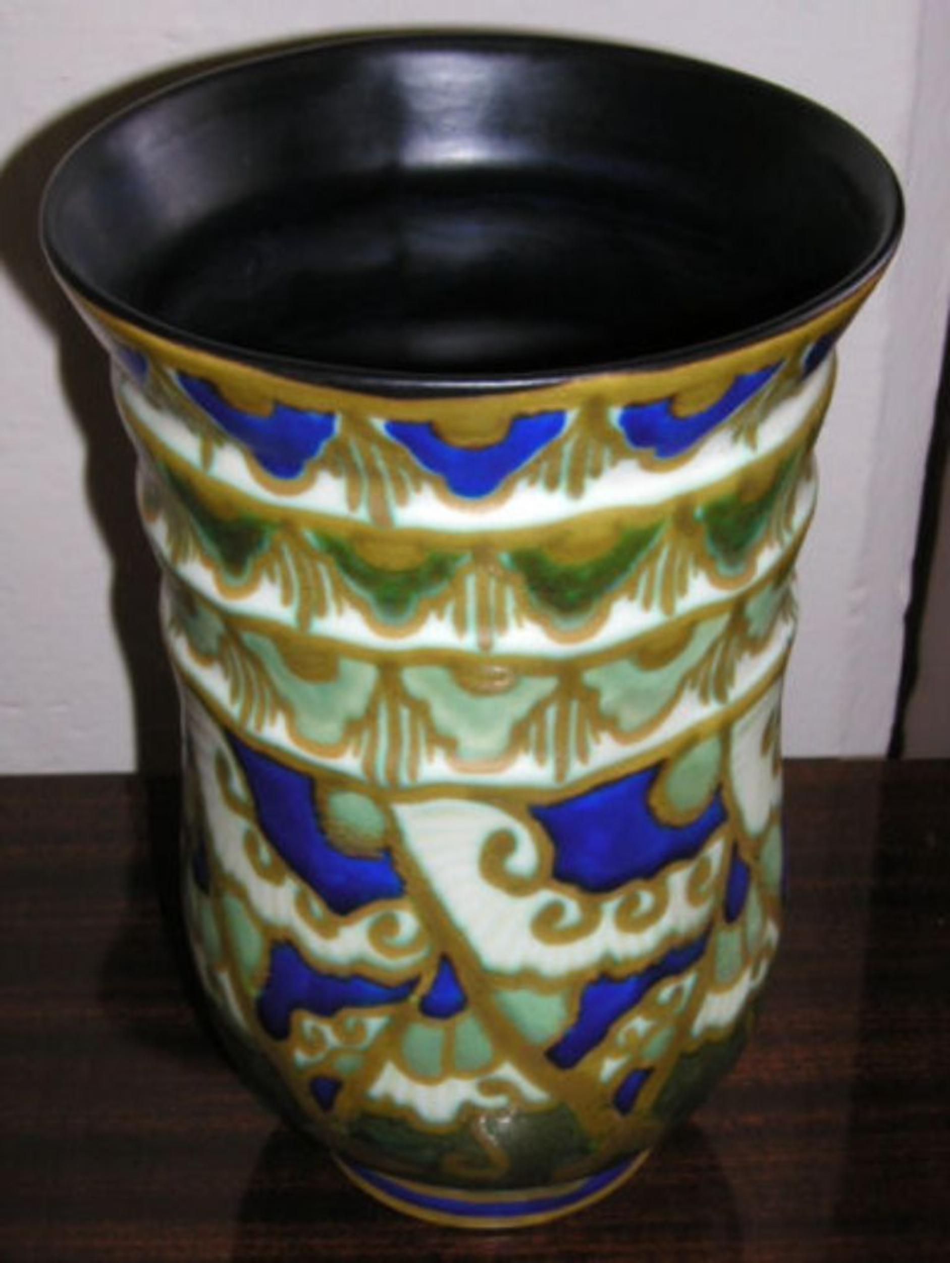 This stunning piece of Boch pottery, with a decidedly organic look, is painted in blue and green, and has a lovely matte finish. Made in Belgium and signed Boch Freres/Keramis.

Measurements
10.75? tall x 6.75? diameter at the opening.