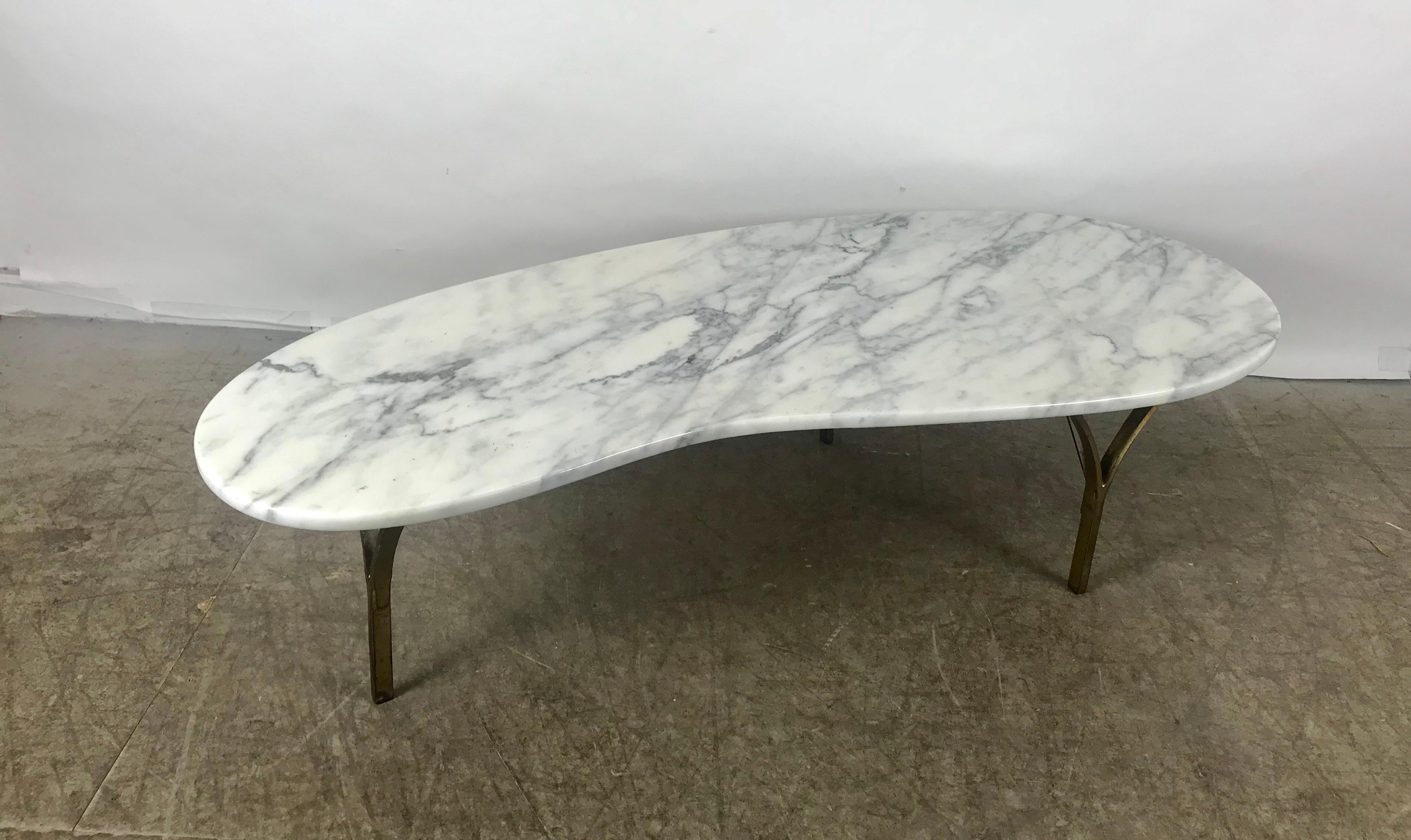 Stunning kidney shape Italian marble and brass coffee or cocktail table, stylized brass base, beautiful Kidney shape polished Italian marble. Hand delivery avail to New York City or anywhere en route from Buffalo NY.