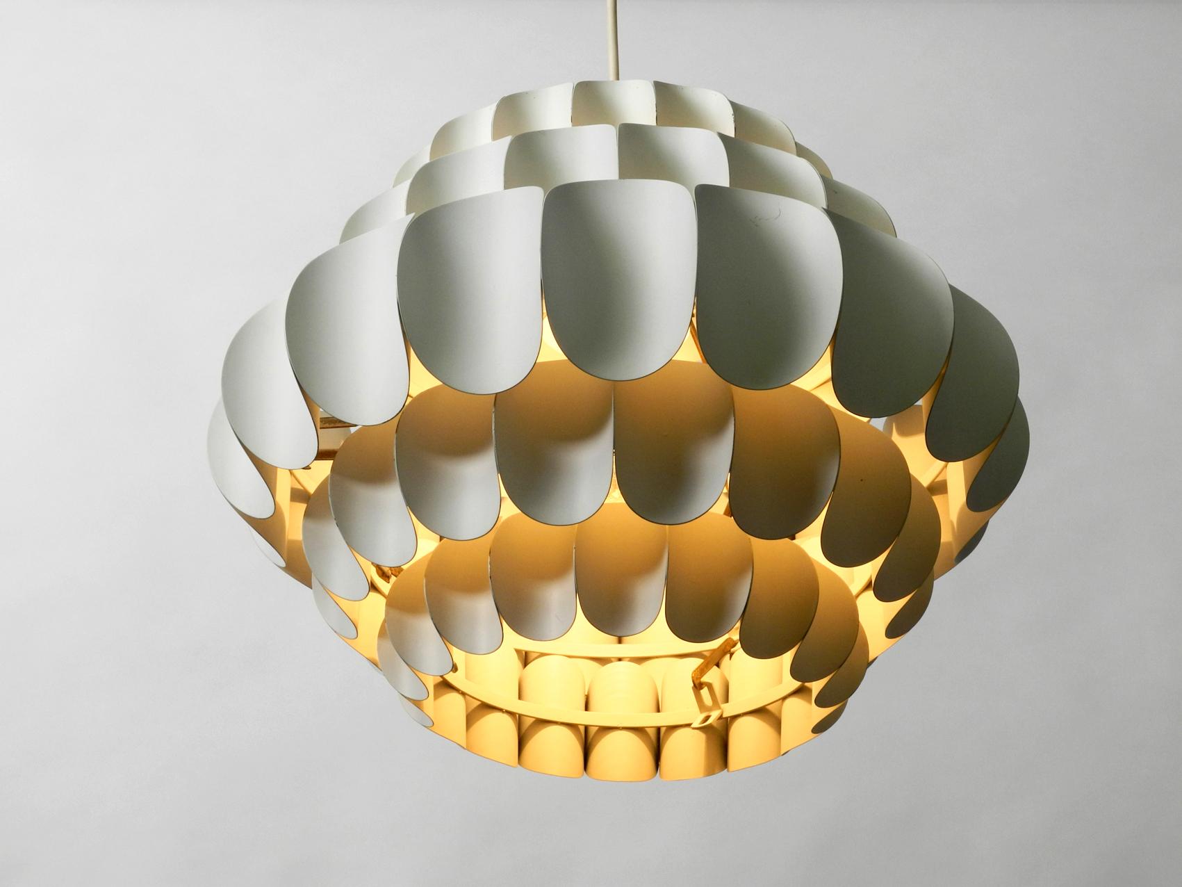 Very rare large 1960s white metal pendant lamp. Design by Thorsten Orrling for Hans-Agne Jakobsson. Made in Sweden. High quality elegant design. Lampshade consists of 5 individual rings, which are assembled together with hooks. Painted and white