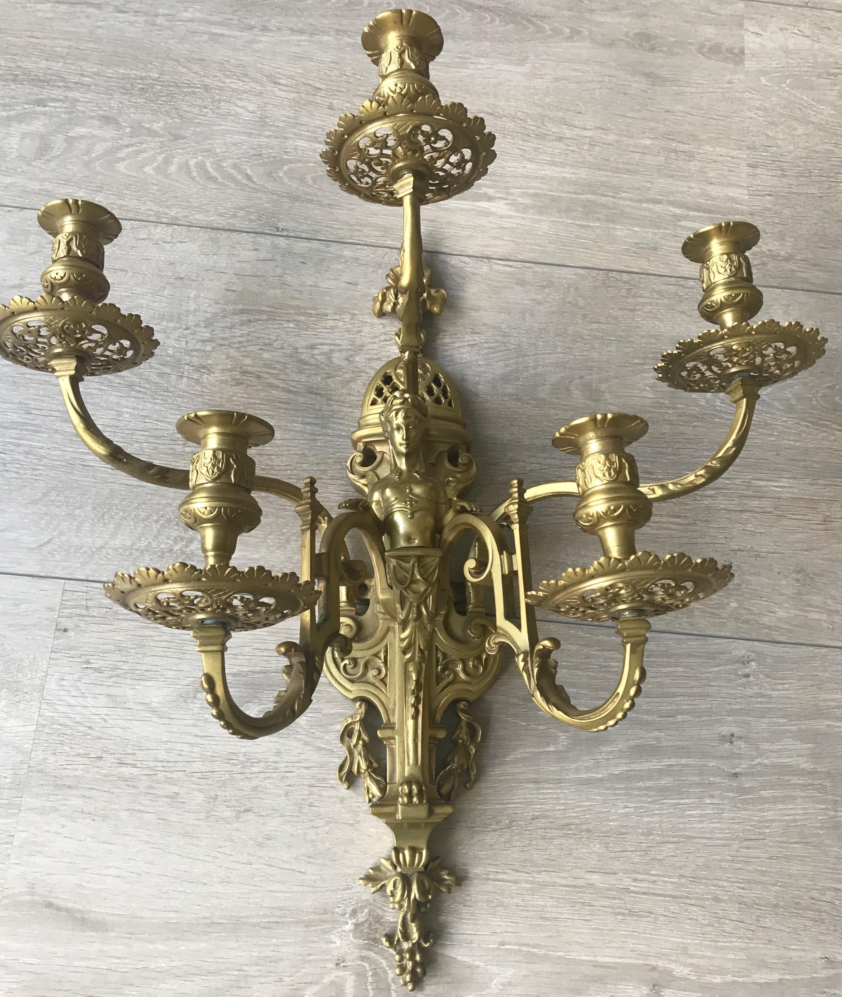One of a kind, five-arm bronze wall fixture that can also be made electrical.

This large and all handcrafted sconce is a joy to own and look at, also if there are no candles in it. However, with the candles burning in the evenings, this late 1800s