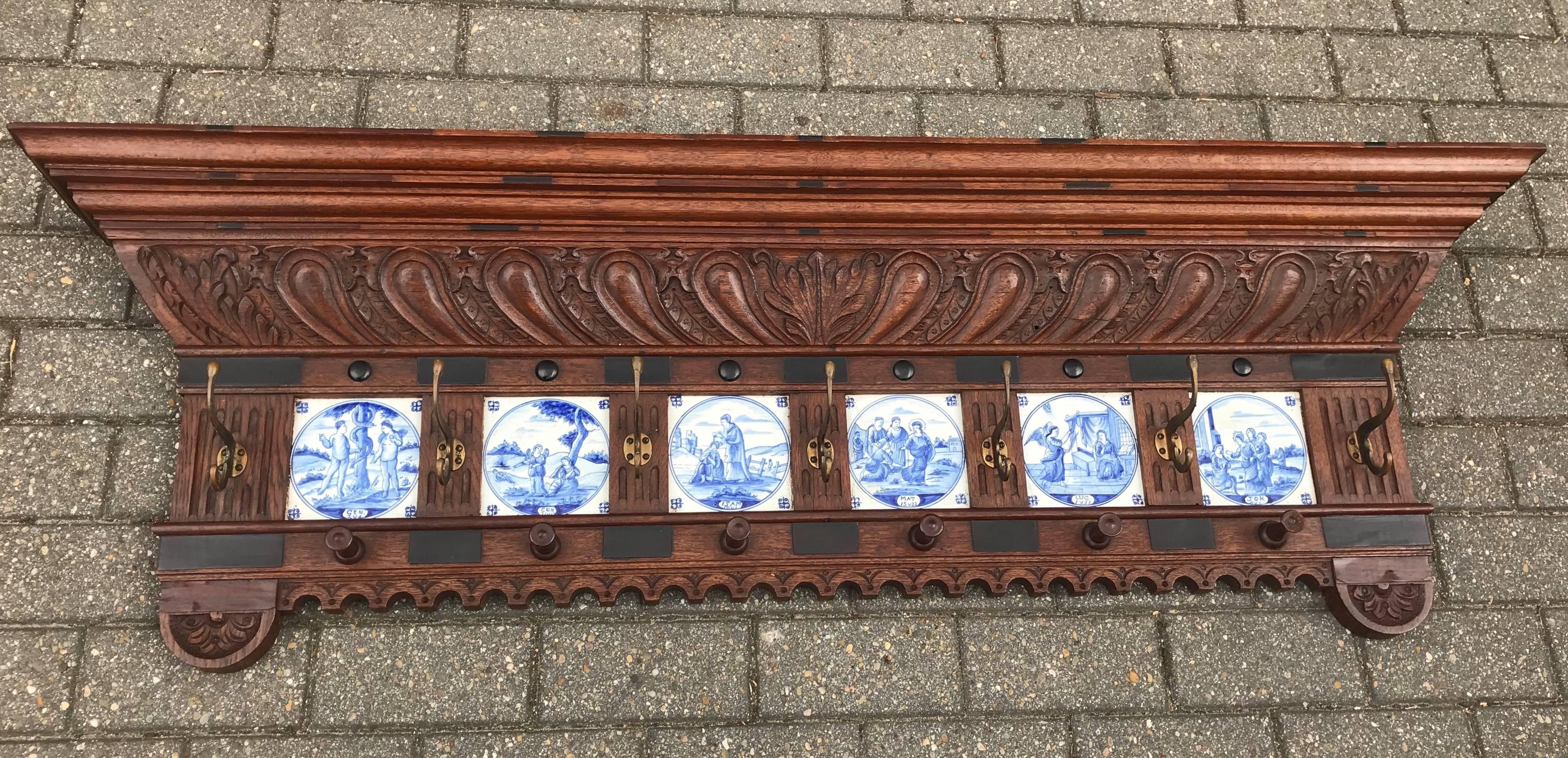 Impressive and all-handcrafted wall coat rack with six delftware tiles.  

If you are a collector of rare antiques and religious art referring to the holy bible then this early 19th century, Renaissance Revival wall coat rack could be perfect for