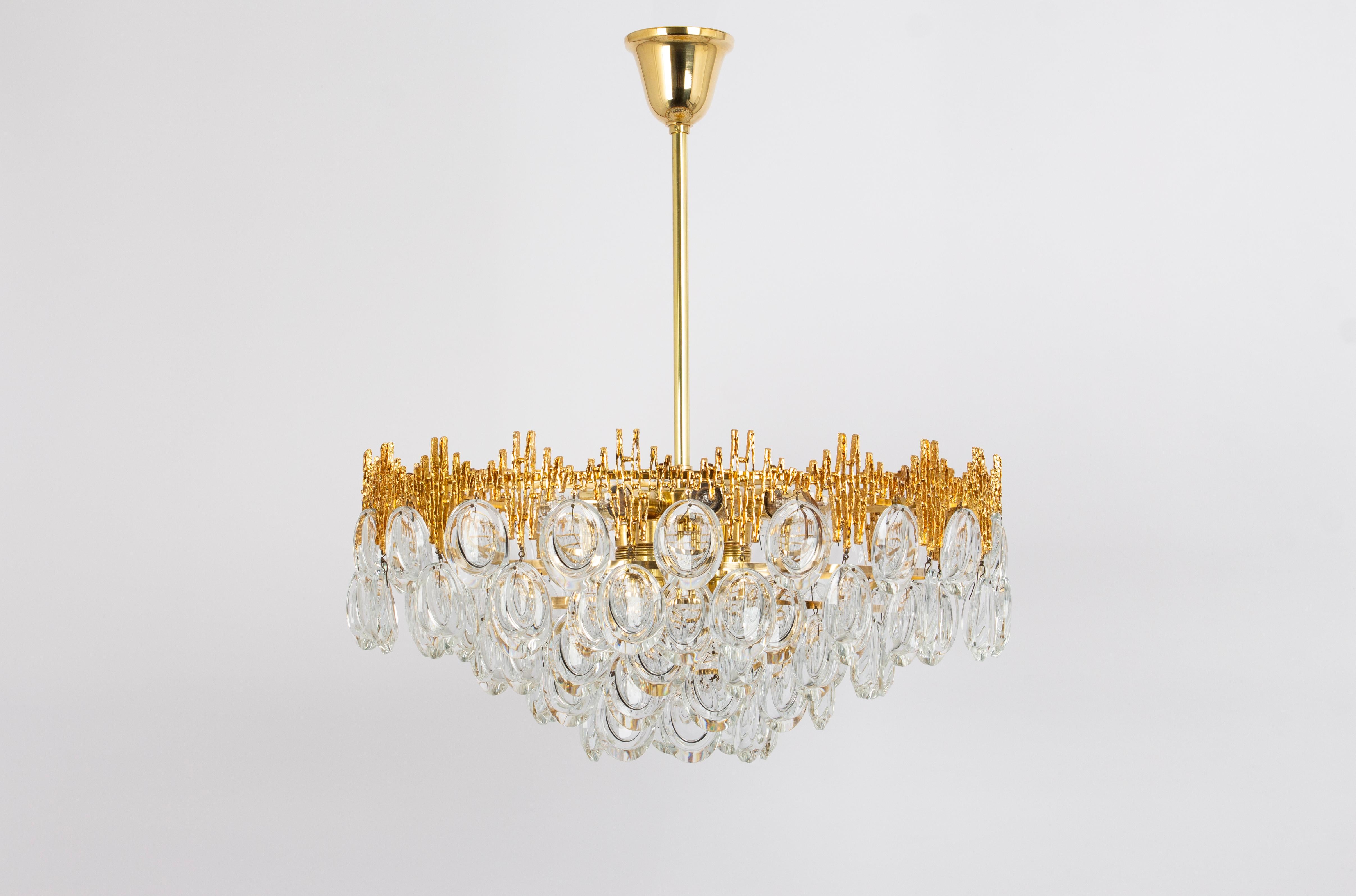 An outstanding and high-quality chandelier made by Palwa, Germany, 1970s.

It is made of a  brass frame decorated with individual Crystal glasses .
Multiple tiers of crystals. Great scale and exquisite detail.

High quality and in very good