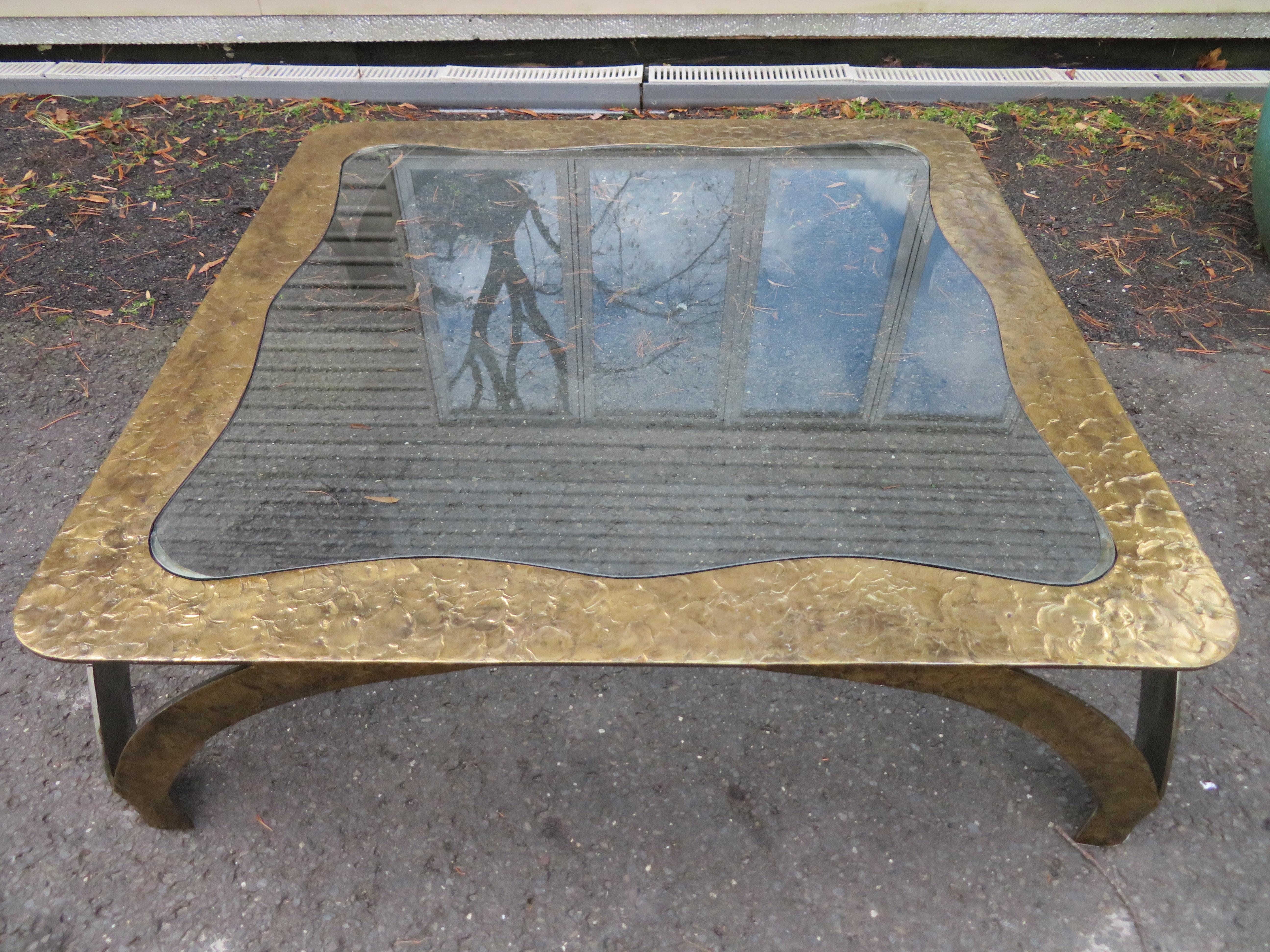 A large square textural bronze coffee table with an inset glass top by Silas Seandel. This wonderful table measures 15.5