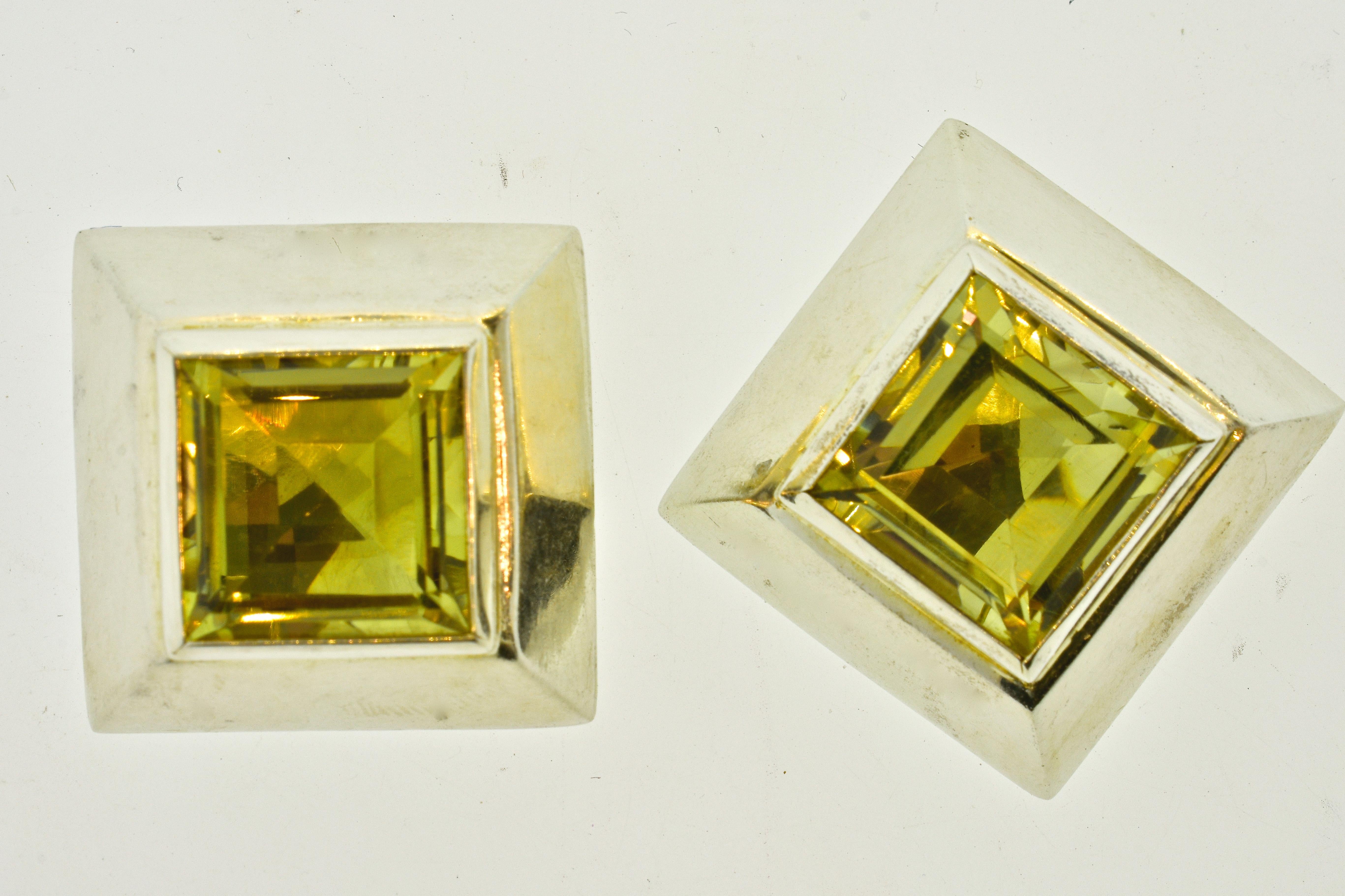 Very Large step cut square natural golden Citrines weighing approximately 20 cts. are set ispiriton these very large sterling silver bold and unusual earrings by the popular and well collected contemporary designer Mark Spirito.  The earrings are 1