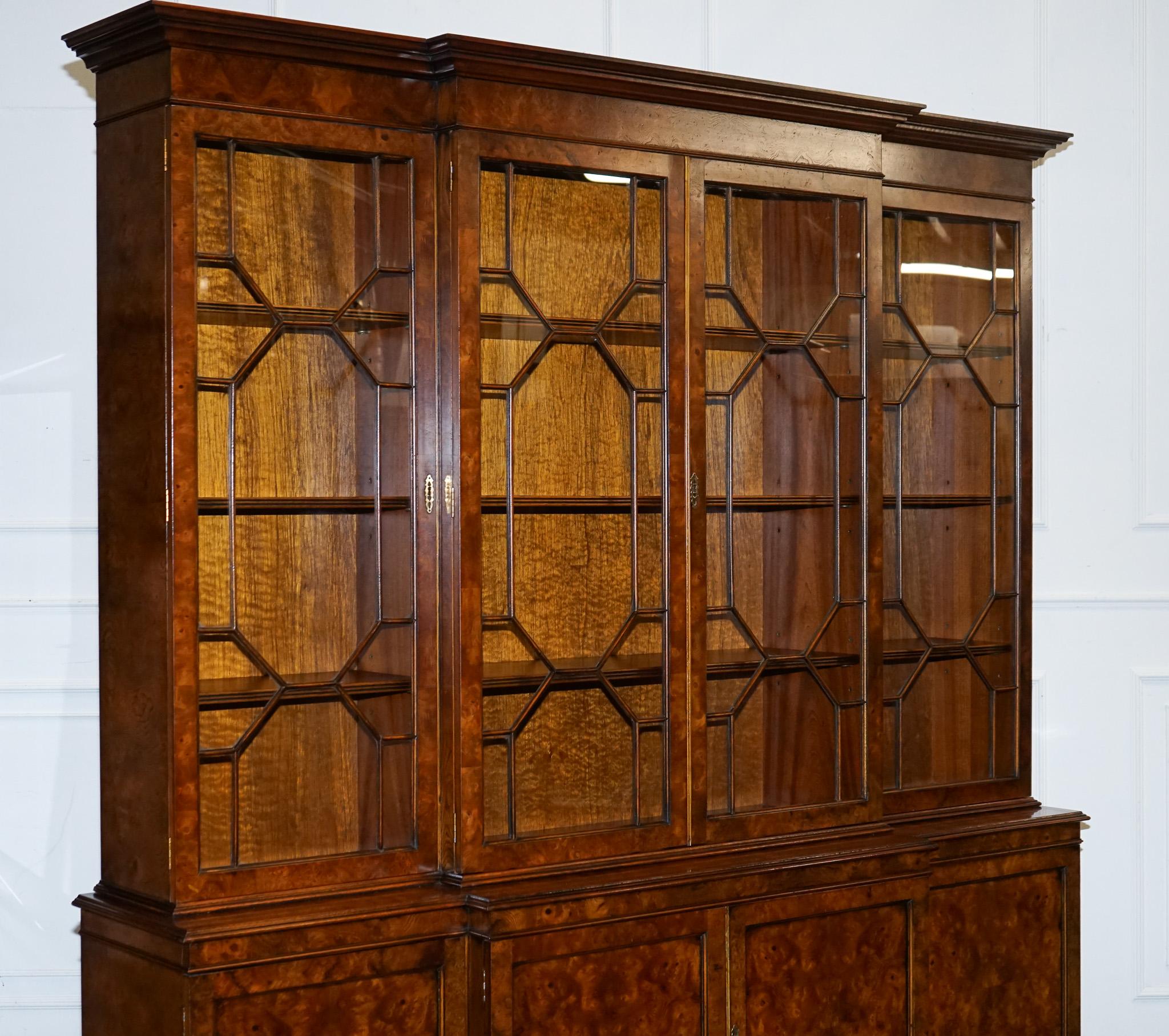 
Antiques of London


A truly breathtaking, large Georgian-style breakfront display cabinet, crafted in exceptionally rich burr walnut, one of the most beautiful examples of its kind. The burr runs generously across the entire piece, creating