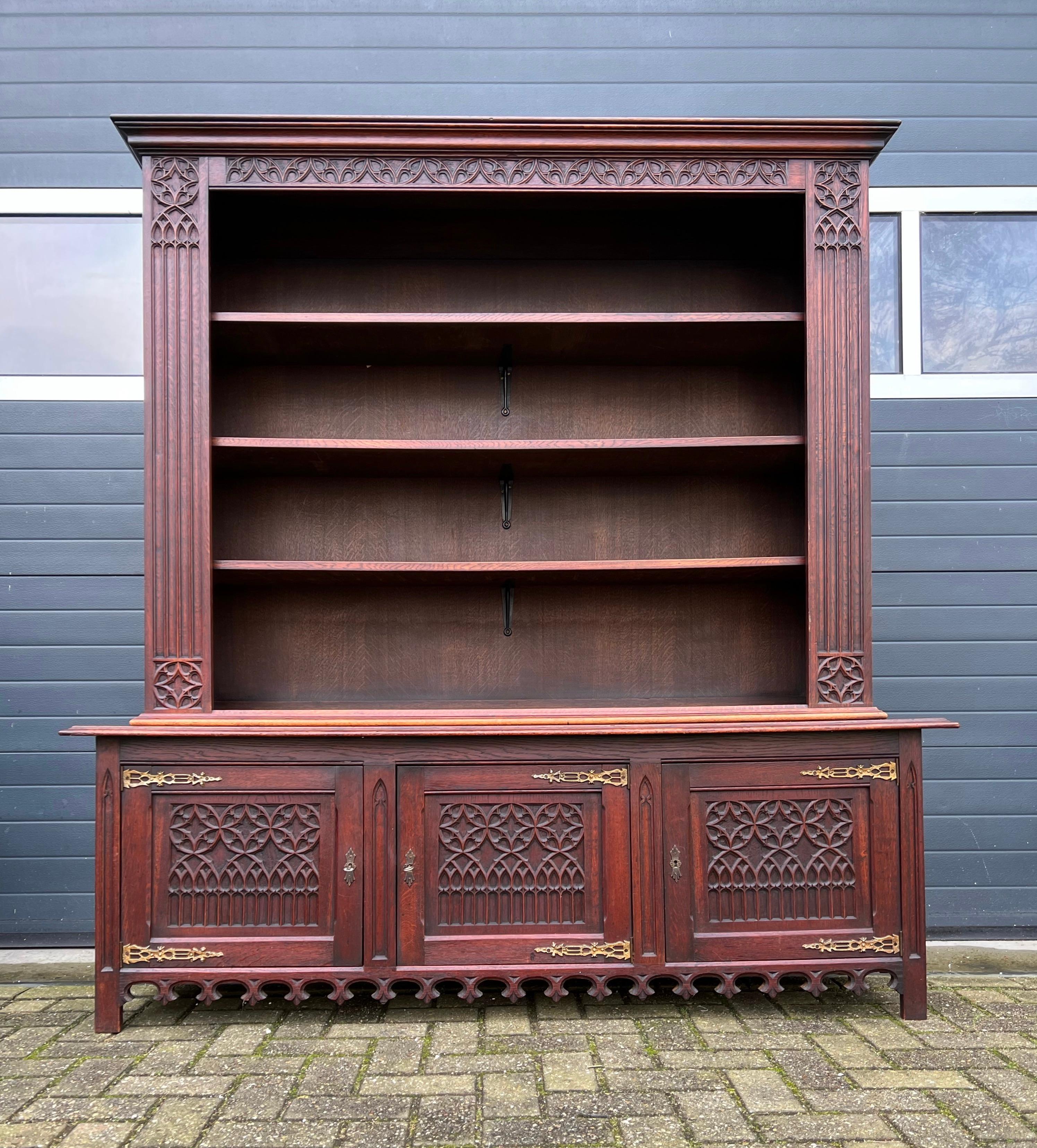 Beautifully handcrafted and excellent condition two-piece Gothic bookcase.

We are always on the lookout for top quality carved and handcrafted Gothic Revival antiques and to have found a bookcase of this size more than made our day. Bookcases are