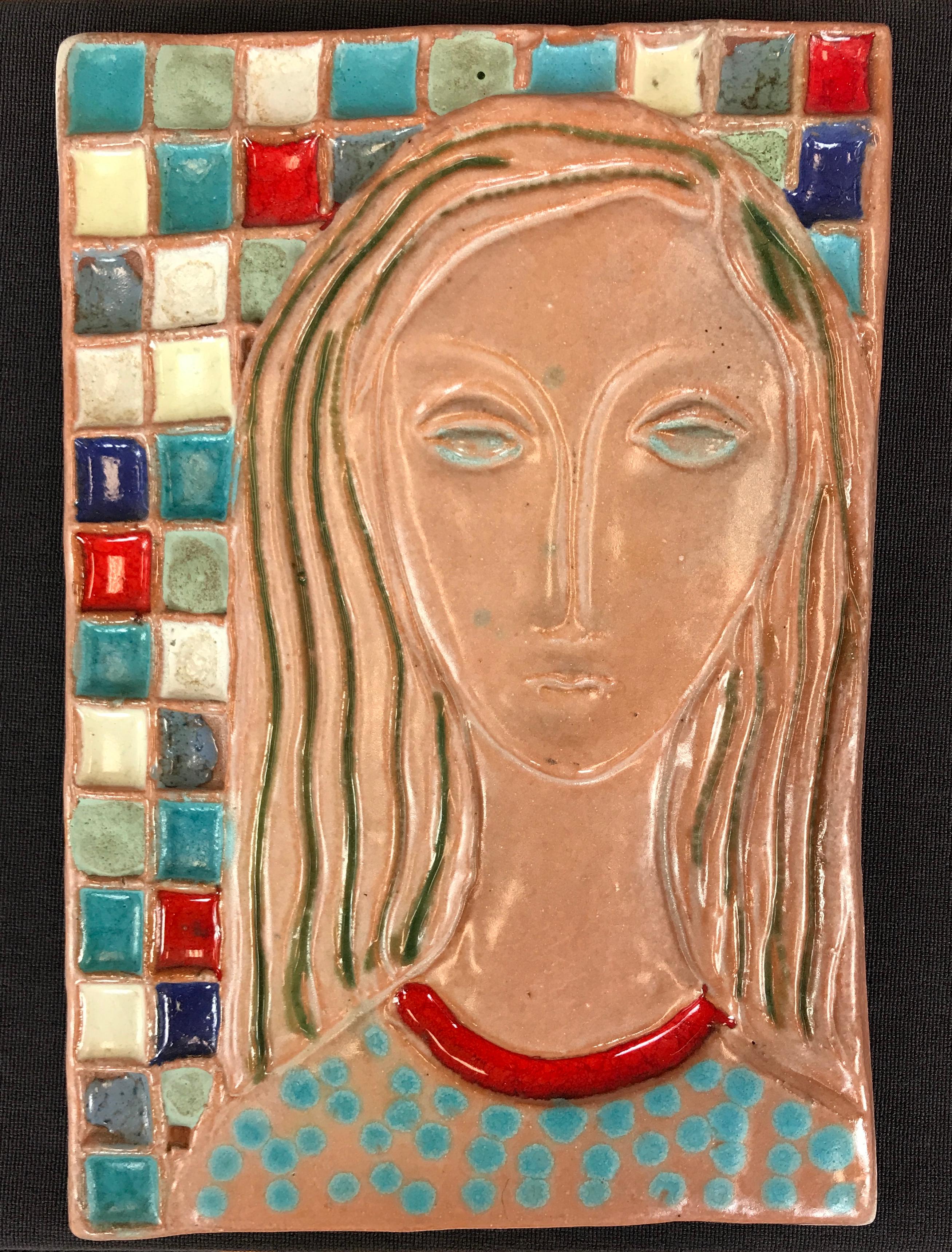 A very large Harris strong ceramic tile art, subject is of a woman with long flowing hair, crew neck dress or shirt, with many squares behind her of many different colors.
The tile is signed back top right.