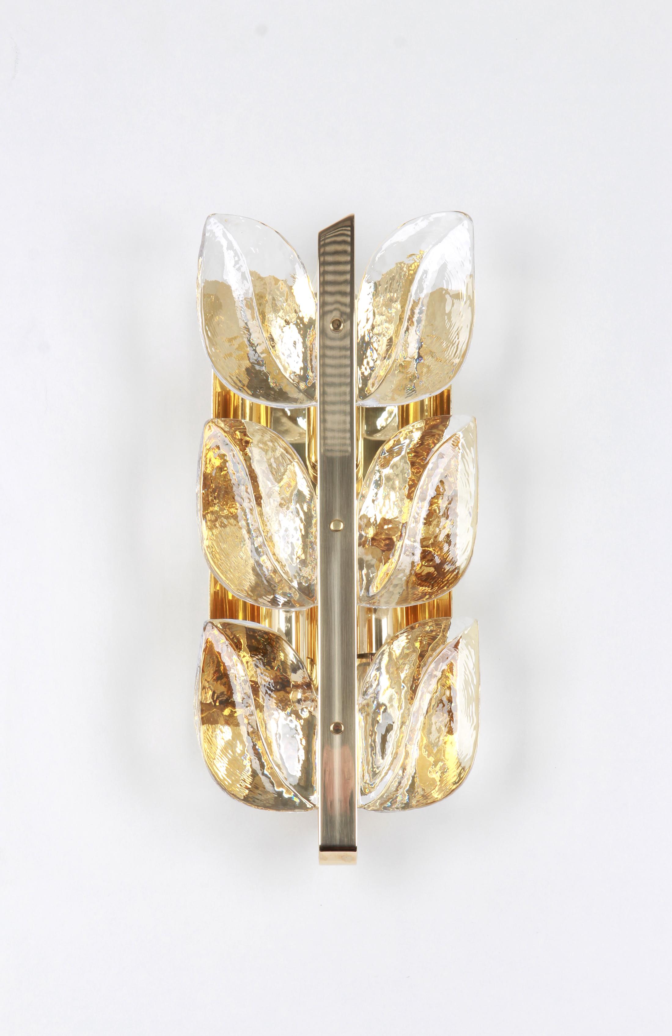 Wonderful midcentury wall sconces with six Murano glass pieces on a brass frame, made by Kalmar, Austria, manufactured, circa 1960-1969.
The sconce needs three E14 small bulbs and they are also compatible with the U.S. Standards
Serie: