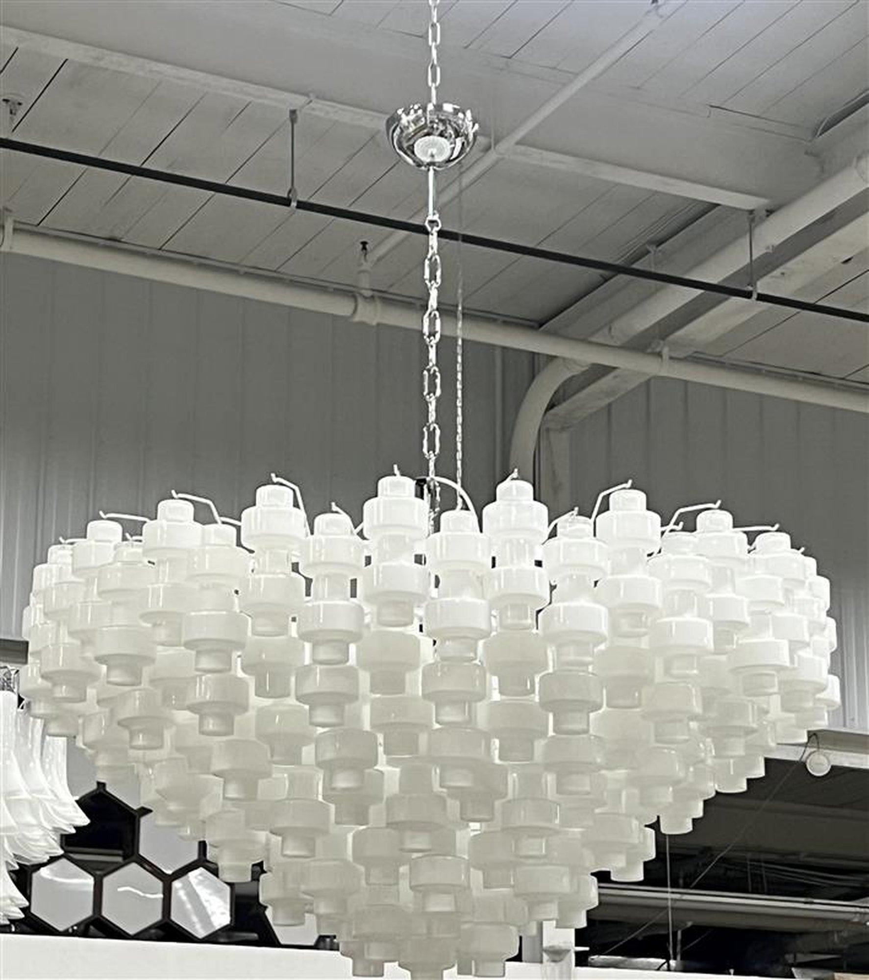 Stunning 6-tiers Murano chandelier by Alberto Donà
167 Pieces of unique shaped, individually hand blown glass pieces in a white glass. White coated steel structure

8 Edison bulbs, wired for the US use.

Height is of structure itself. Can be