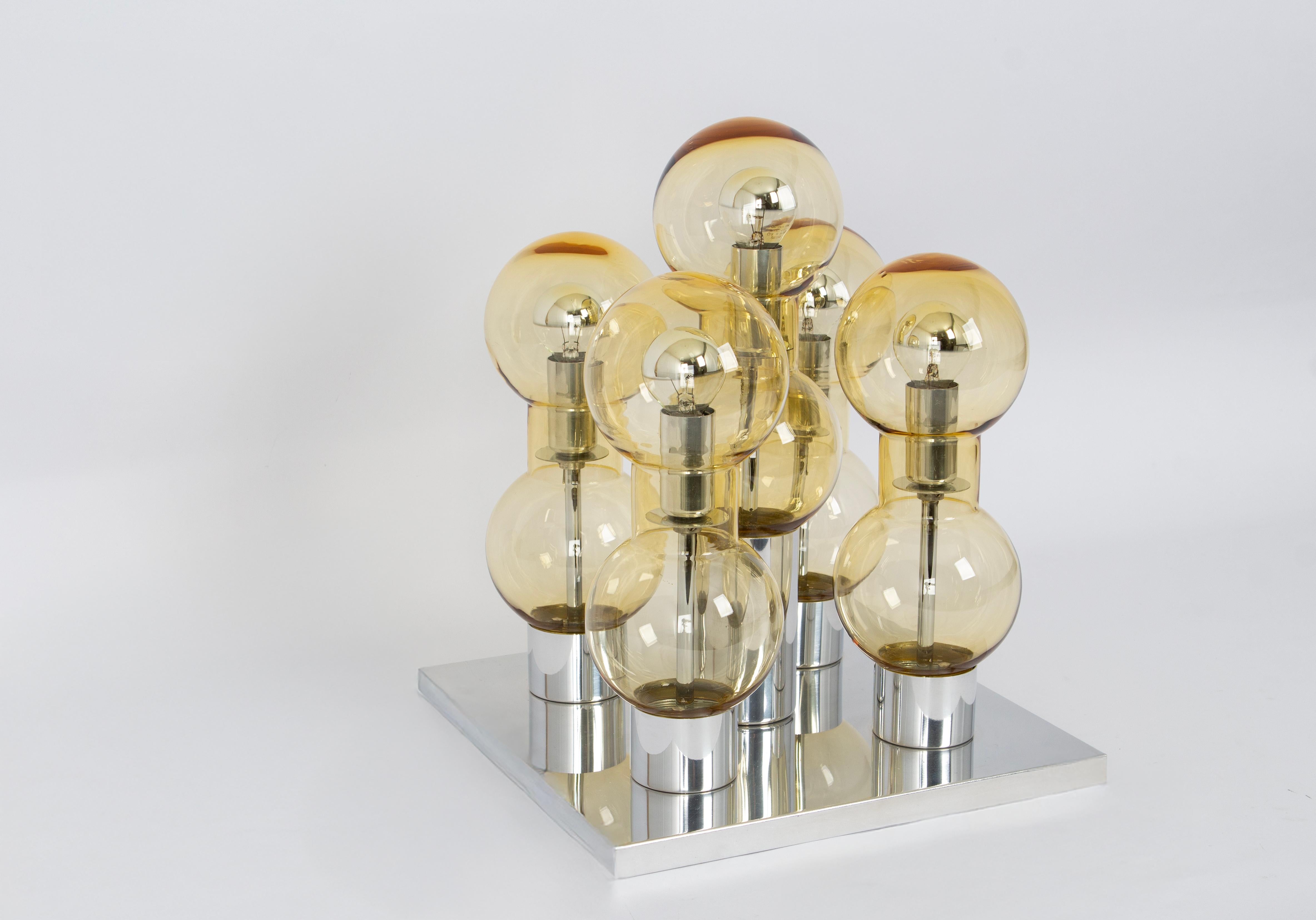 Fantastic chrome mid-century Flush mount by Doria, Germany, manufactured circa 1970-1979 with 5 glass cylinders suspended from the fixture.
Heavy quality and in very good condition. Cleaned, well-wired, and ready to use.
Wonderful light effect.

The