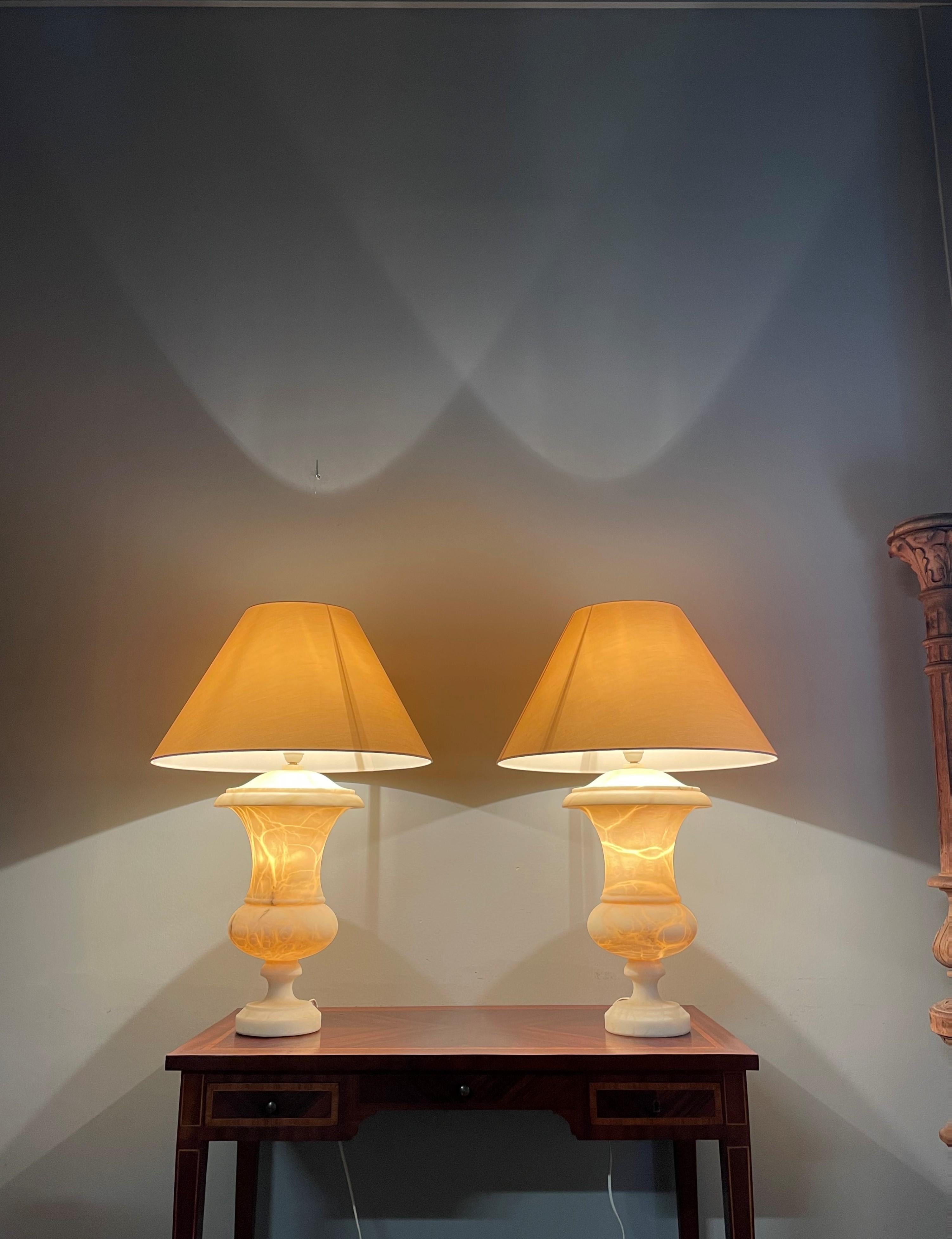 Impressive design, largest size and beautiful atmosphere creating table lights.

This rare and very impressive pair of handcrafted, mineral stone table lamps is another one of our recent great finds. With their large size and timeless design these
