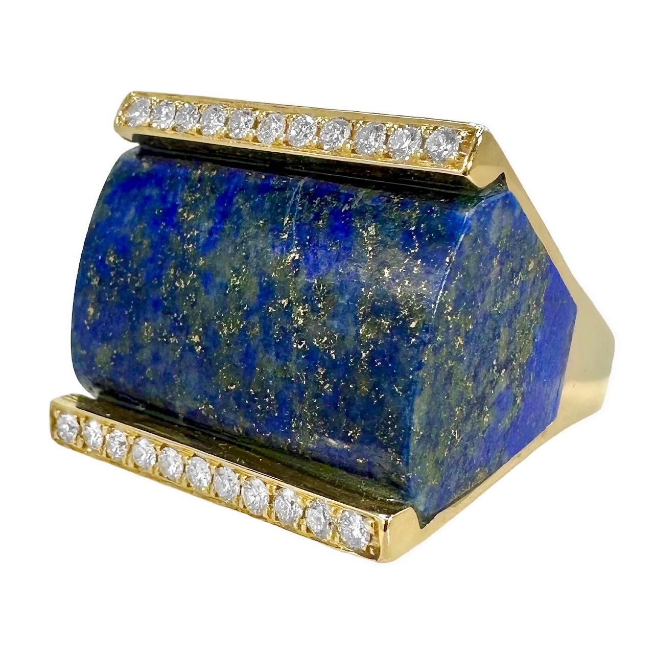 The striking piece of lapis-lazuli, which is custom cut into the ring, is slightly bombe on the top, and is flanked by a single line of fine diamonds on each side. This is a truly  exceptional piece of jewelry, in scale as well as aesthetic appeal.