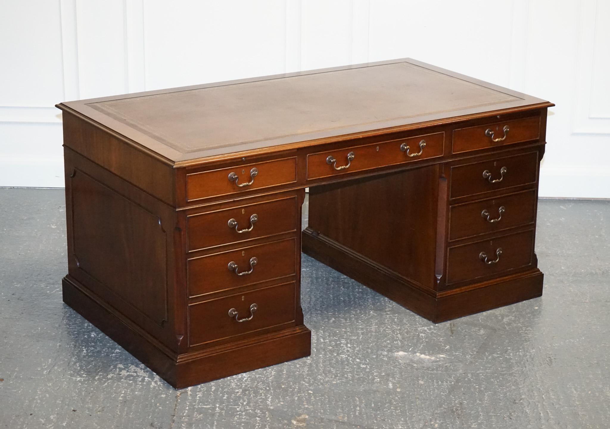 
We are delighted to offer for sale this Lovely Large Twin Pedestal Desk Brown Leather Top With Sliding out trays.

A Large Twin Pedestal Desk with a Brown Leather Top and Sliding Out Trays on each pedestal is a luxurious and functional piece of