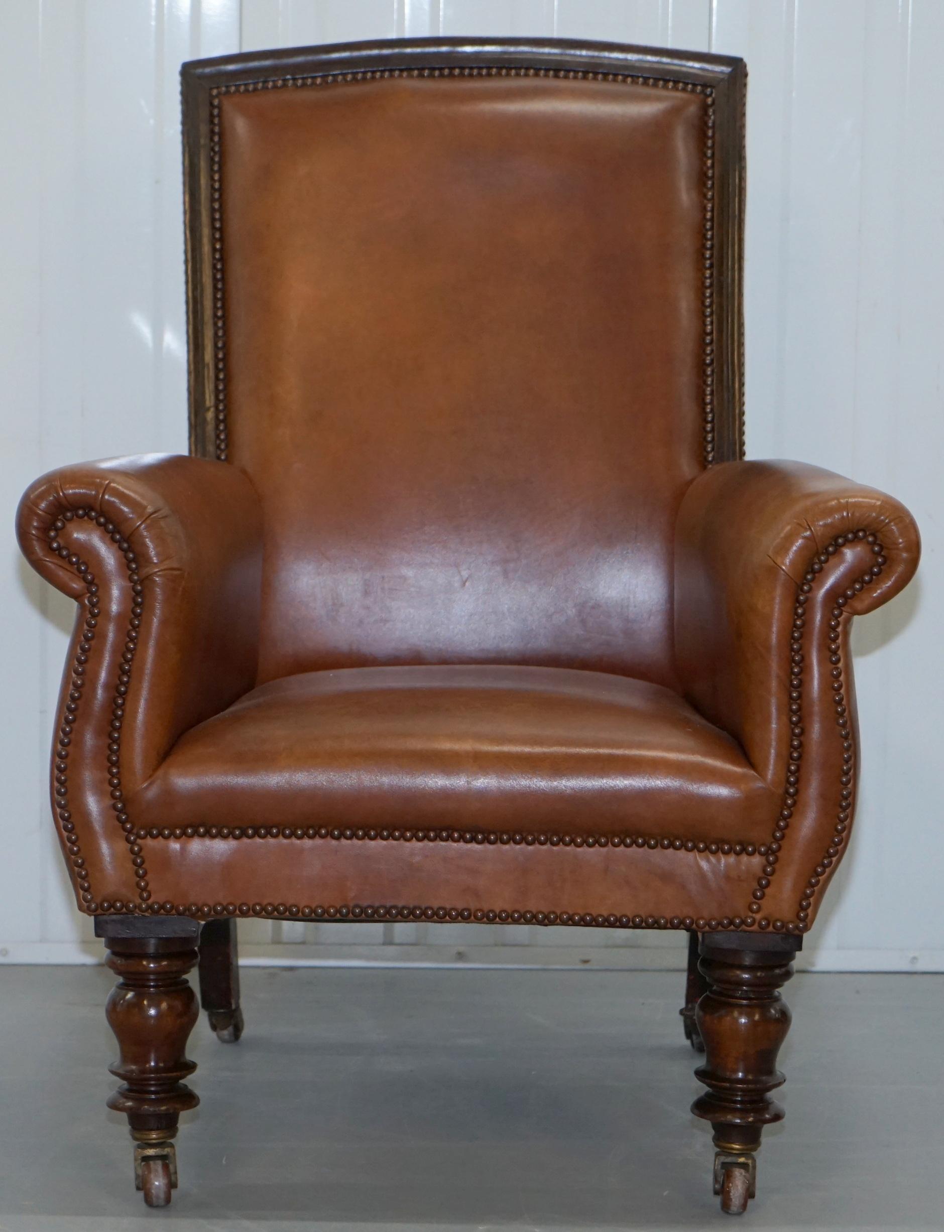 We are delighted to offer for sale this lovely restored Victorian library reading armchair in vintage aged brown leather

A good looking and very well made chair, the chair legs are exceptionally chunky on the front and finished with period