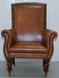 Superbe grand fauteuil de lecture victorien de bibliothèque en cuir marron vieilli acajou