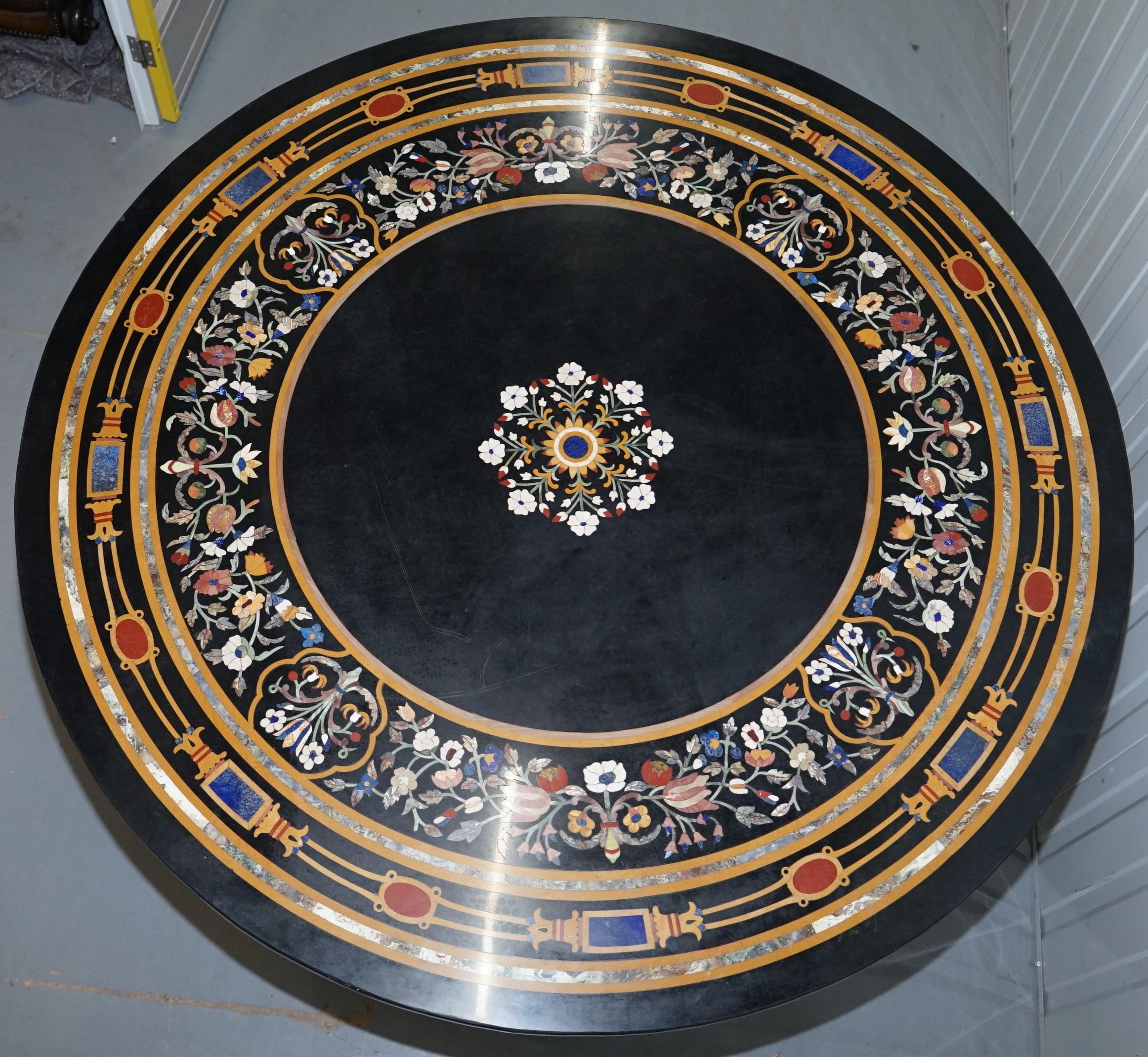 We are delighted to offer for sale this very ornate large round Pietra Dura specimen marble dining room table 

A very good looking heavy and substantial piece of decorative furniture, there are literally hundreds of cuts of marble each perfectly