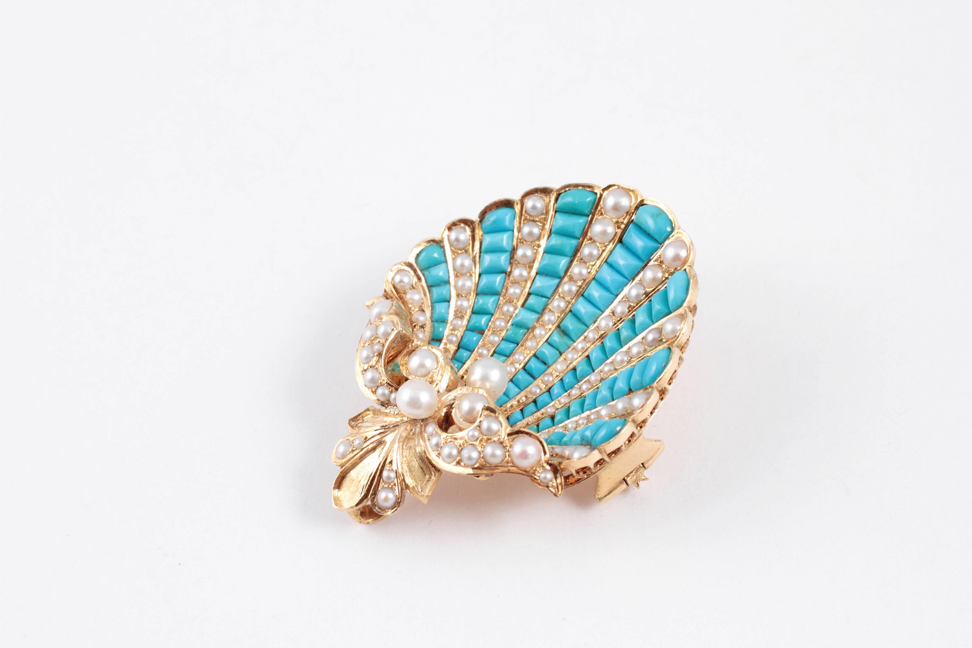 A treasure from the late Victorian period, this lovely 18 karat yellow gold brooch features rows of turquoise alternating with pearls and is secured with a pin clasp.  The bonus is that it can also be worn as a pendant! 