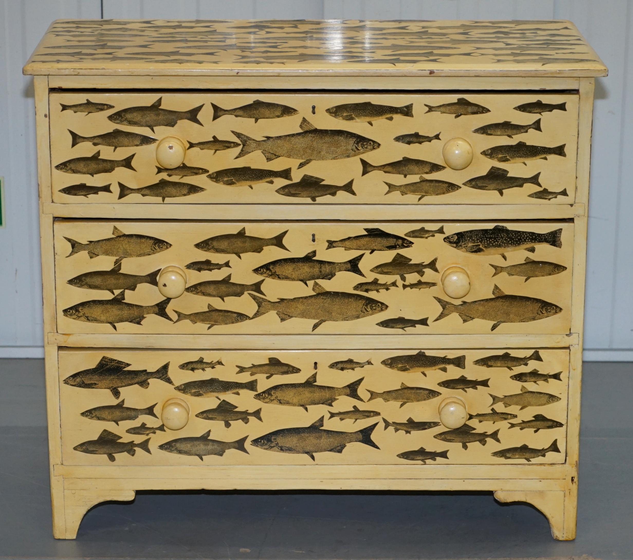 We are delighted to this stunning original Victorian 19th century hand made Chest of drawers retailed through Liberty’s London with original paint and fish decoupage pictures

A very decorative piece, these almost never come up for sale as they