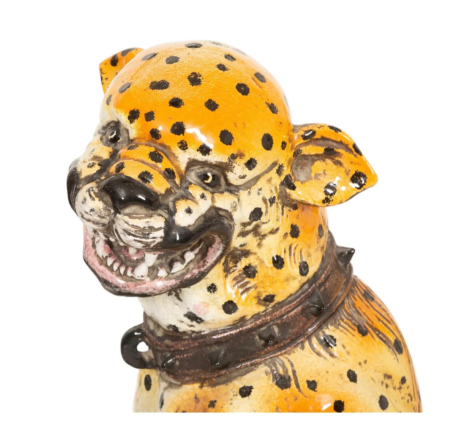 Magnificent early 20th Century Italian Glazed Terracotta Seated Leopard. Vivid colors of orange and yellow with dark brown spots on bright green pillow. Great natural facial expression with open mouth showing teeth. 
