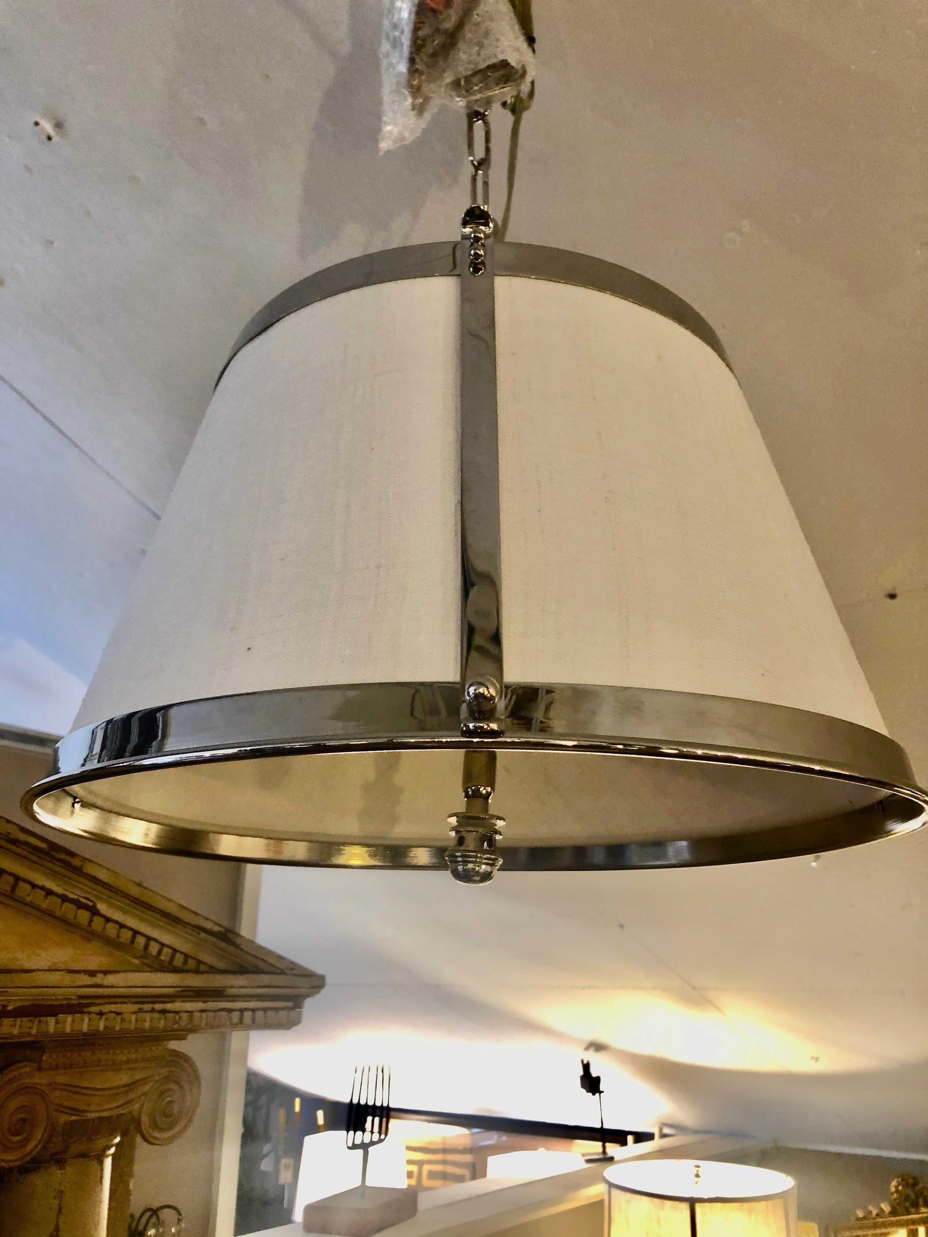 Handsome polished nickel and linen lamp shade shaped light fixture with matching ceiling cap.