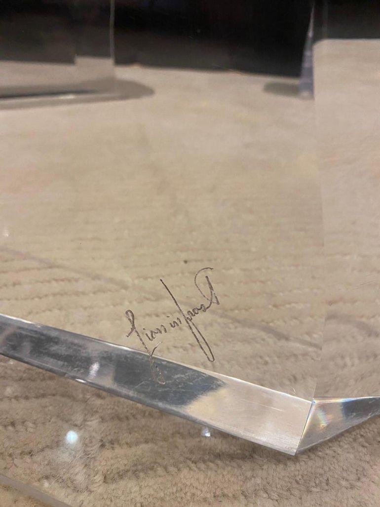 Stunning Lion in Frost signed dining table, USA, 1970s.
It includes four pieces that go on top of the glass, which gives it the look of the acrylic going through the glass.
Also an acrylic platform is included for support of the base.

Measures: