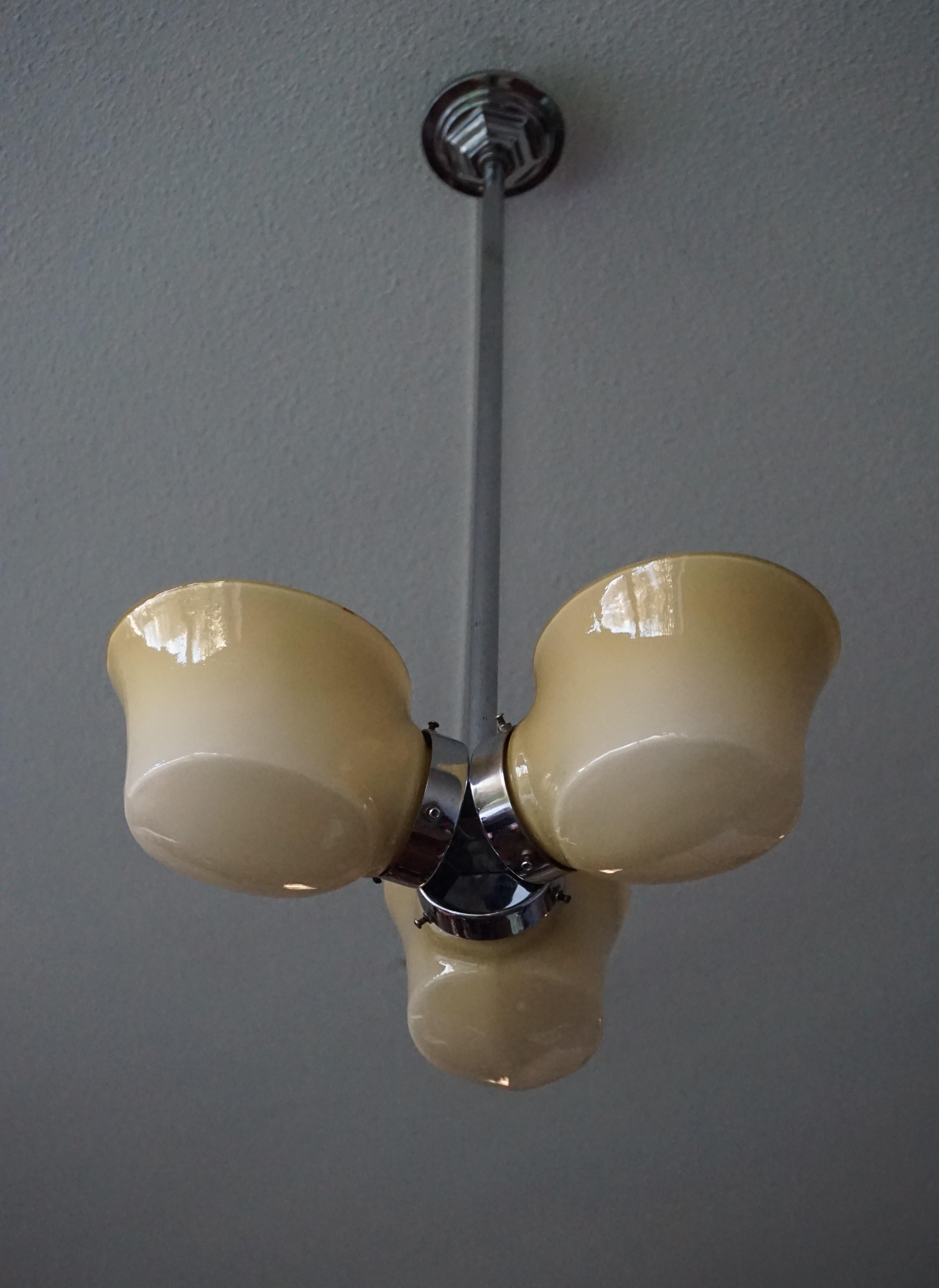 Rare and possibly unique Art Deco / modernist fixture.

We have been selling antique light fixtures for as long as we have had our business and we never stop being amazed by their aesthetic beauty, the quality of the materials and the way these