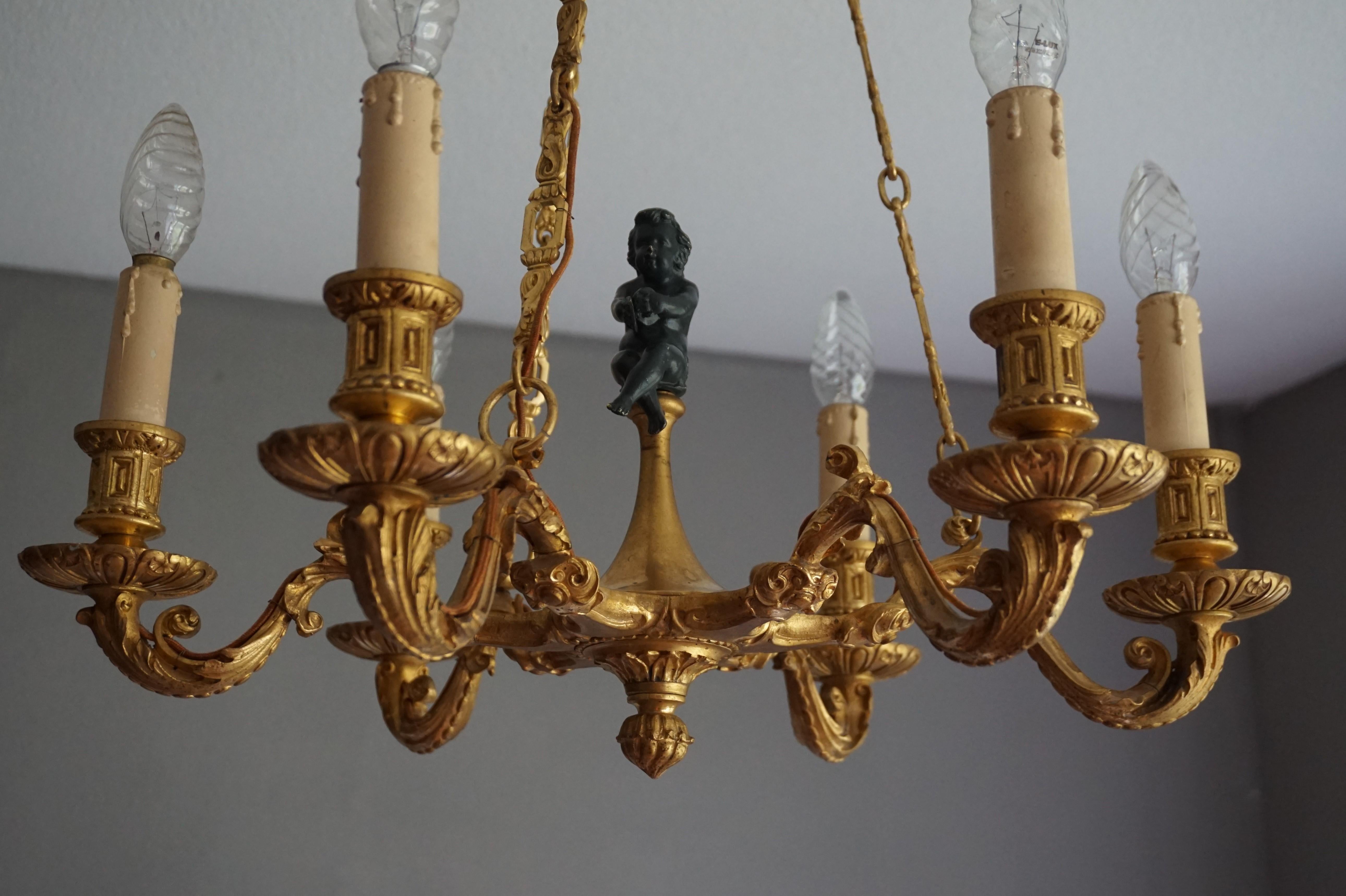 Semi antique and beautifully gilded French chandelier.

This beautifully gilt French chandelier both on and off will literally light up the room she is in. We love everything about this gilt bronze work of lighting art. It is perfectly balanced, it