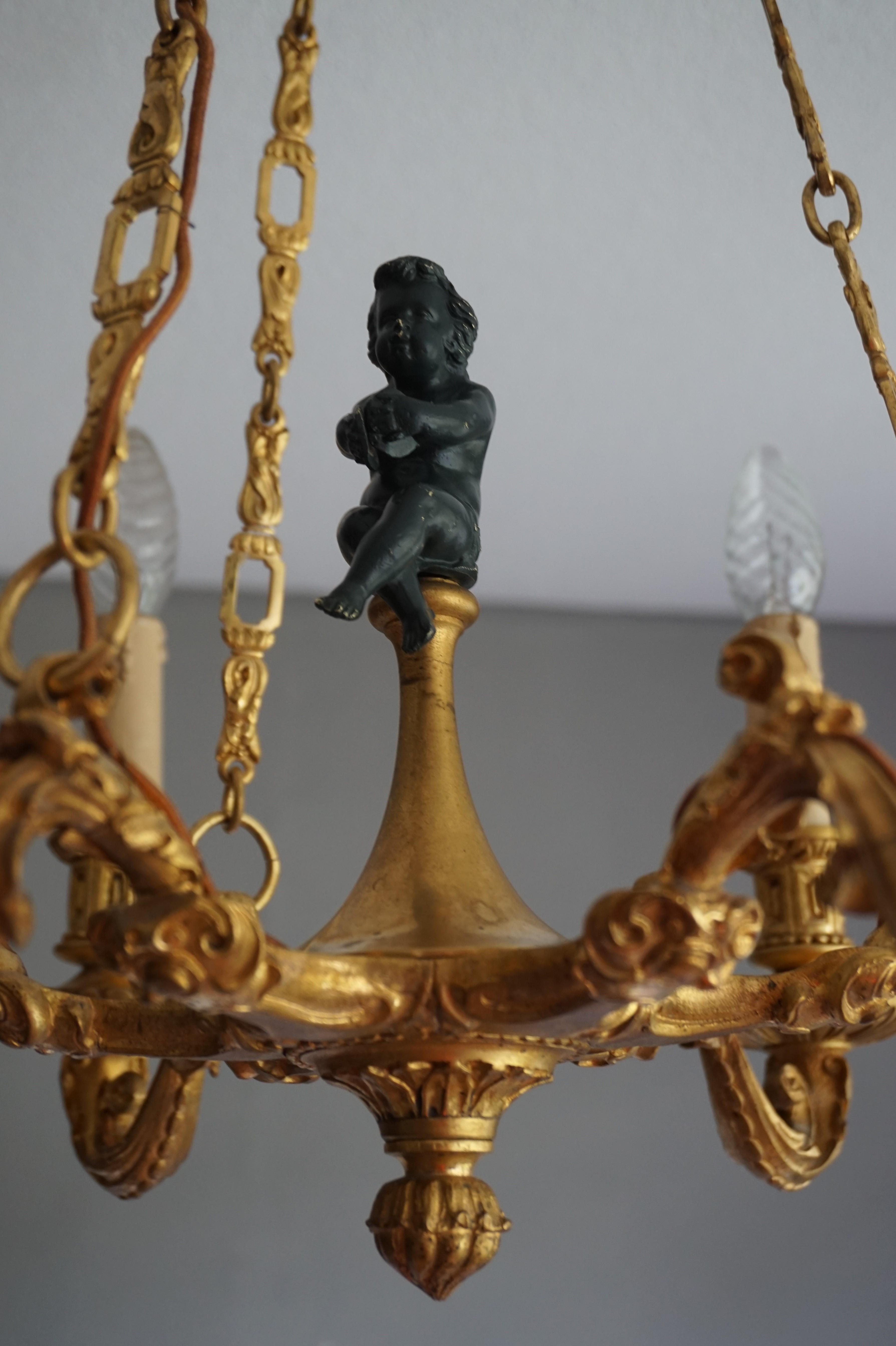 French Stunning Little Gilt Bronze Chandelier with Scrolling Leafs and Putto Sculpture For Sale