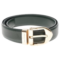 Stunning Louis Vuitton belt in green Taïga leather and golden