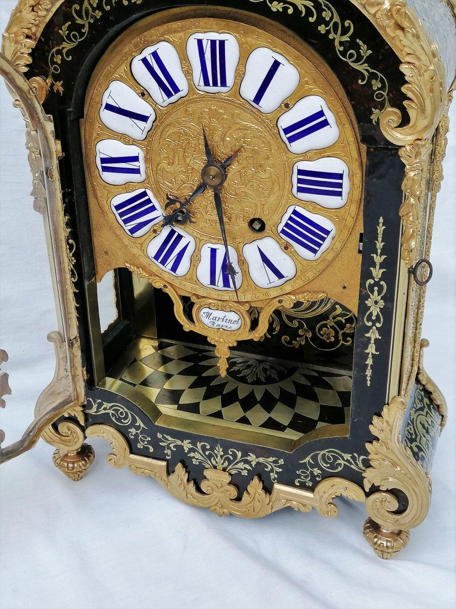 Rare and tall Louis XIV style cartel table clock entirely covered with Boulle style marquetry in engraved brass on a background of brown tortoiseshell.
The inside part of the door and the base are also inlaid. Splendid ornamental bronzes, very