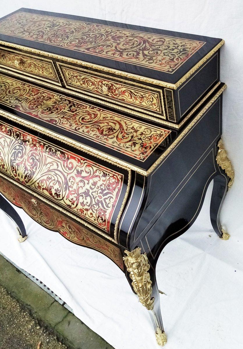 Stunning and really large Louis XV style secretary desk cabinet in Boulle style Marquetry, cylinder shape, in ebony veneer and Boulle and brass marquetry on a background of red tortoiseshell.
Gorgeous gilt bronze ornaments, the upper part has two