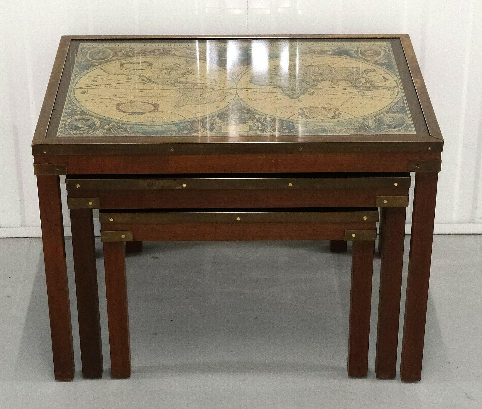 We are delighted to offer for sale this elegant Military Campaign mahogany nest of tables with world maps.

This is a very good looking, solid and decorative nest of tables with brass fitting and fixtures. Each of the tables show a vintage world